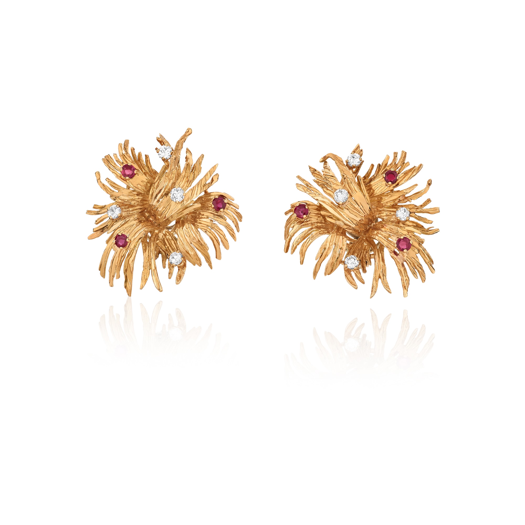 <p><strong>CHAUMET</strong>&nbsp;<em>Pair of gold, ruby and diamond ear clips</em></p>
