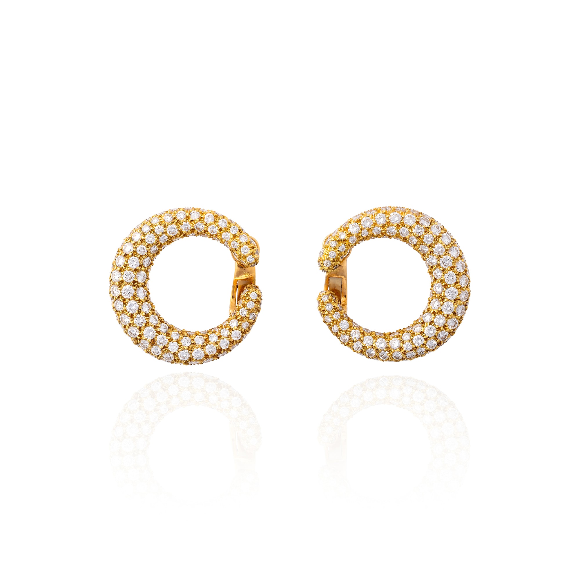<p><strong>CARTIER</strong> <em>Pair of diamond and gold earrings</em></p>
