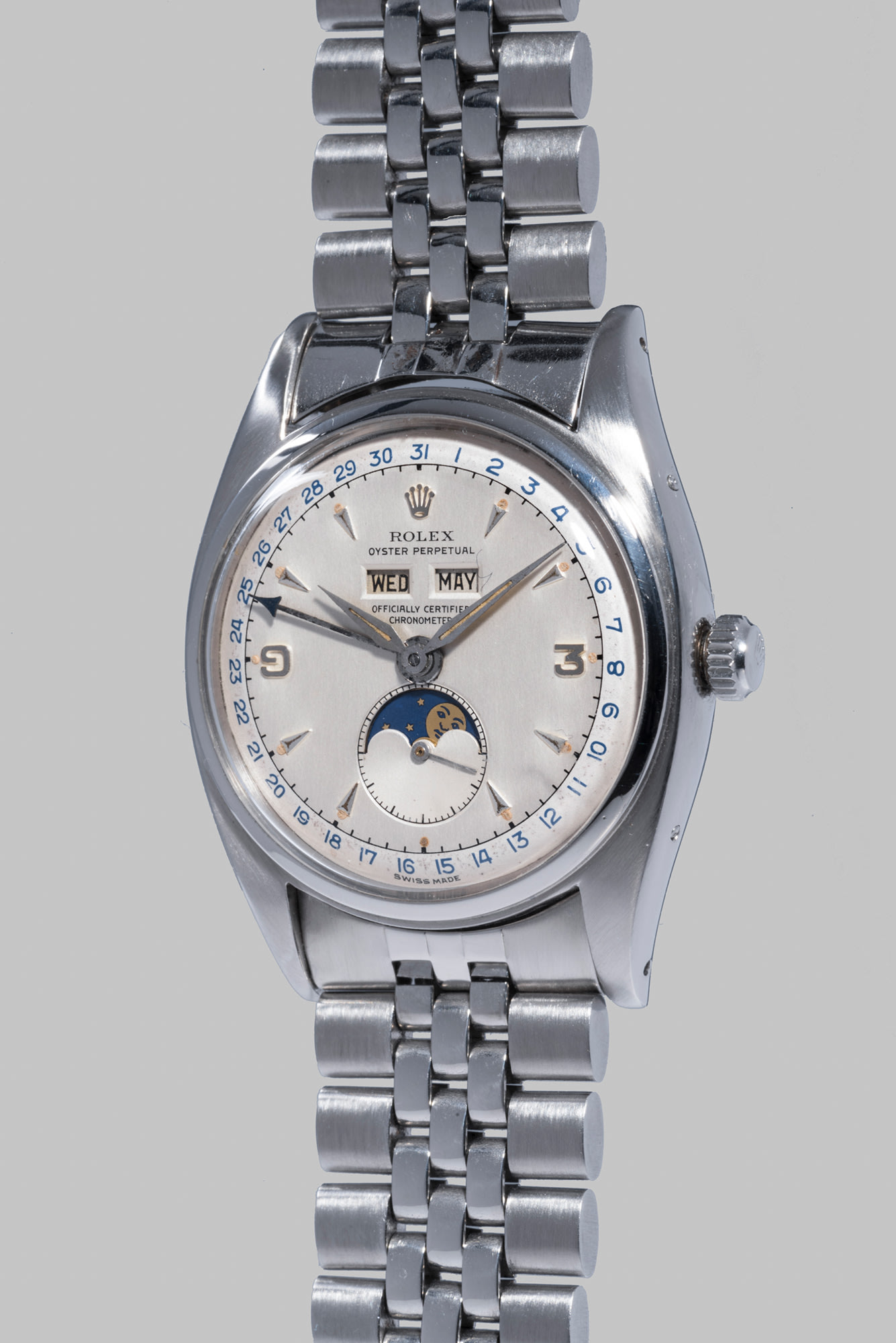 <b>ROLEX </b>Reference 6062, circa 1953. An incredibly rare and most attractive stainless steel triple calendar wristwatch with two-tone dial, moonphases and bracelet.