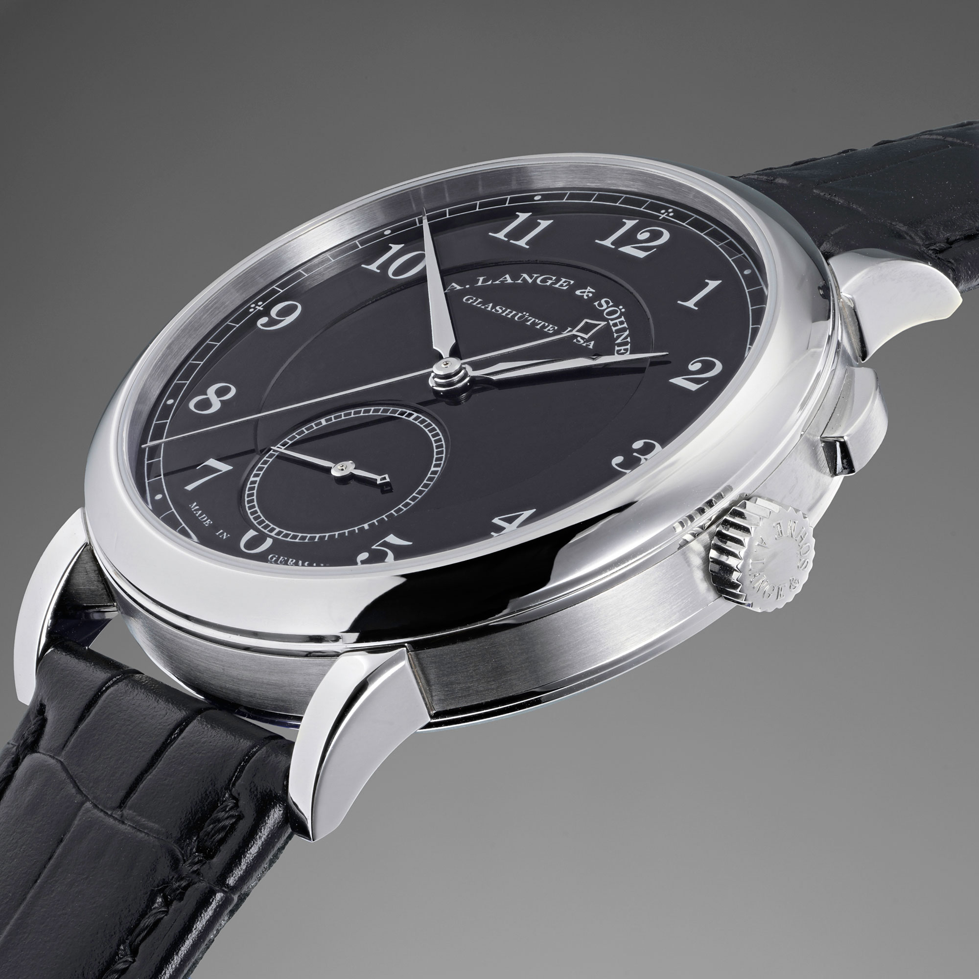 A unique and highly attractive stainless steel A. Lange &amp; S&#246;hne wristwatch with independently stoppable jumping seconds and black enamel dial