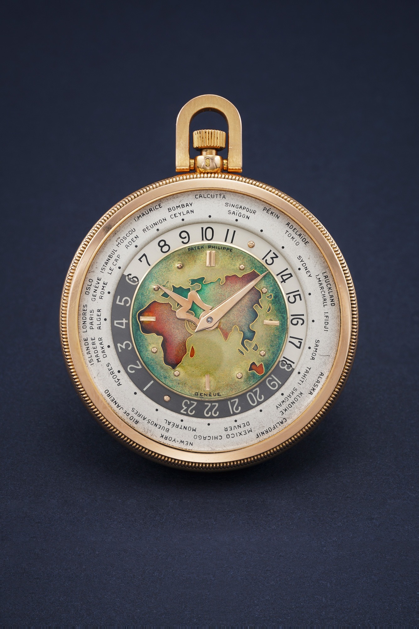 <p>A previously unknown and most probably unique pink gold open face worldtime Patek Philippe Ref. 605 HU with cloisonn&eacute; enamel dial depicting a map of Europe, Asia, Africa</p>
