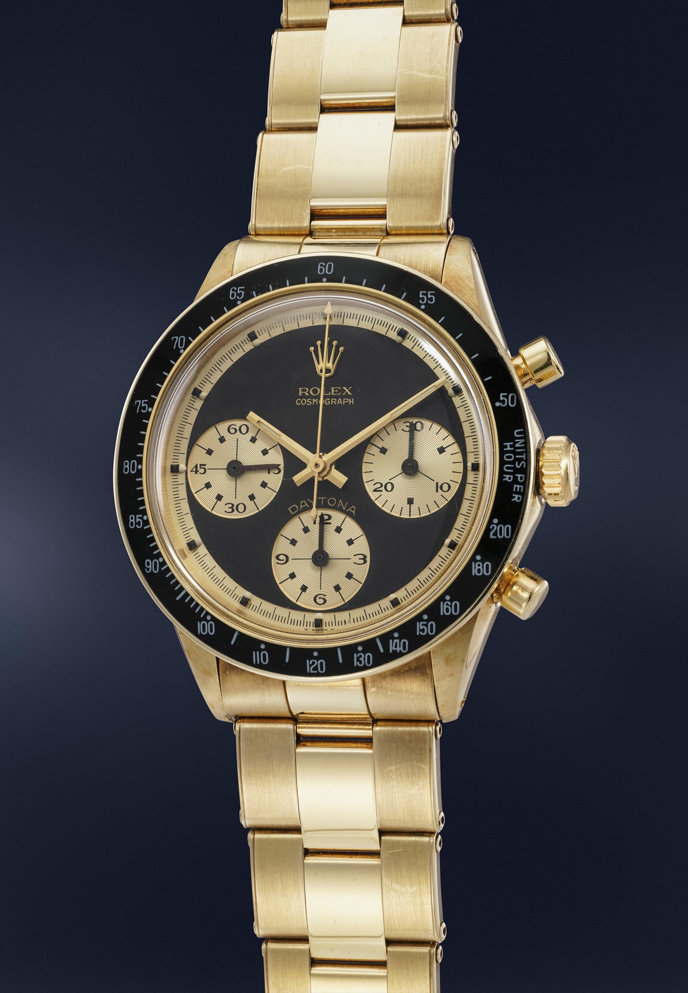 <p>A very rare, highly important and extremely attractive 14K yellow gold chronograph Rolex Cosmograph Daytona Ref. 6241 with Paul Newman John Player Special dial and bracelet</p>
