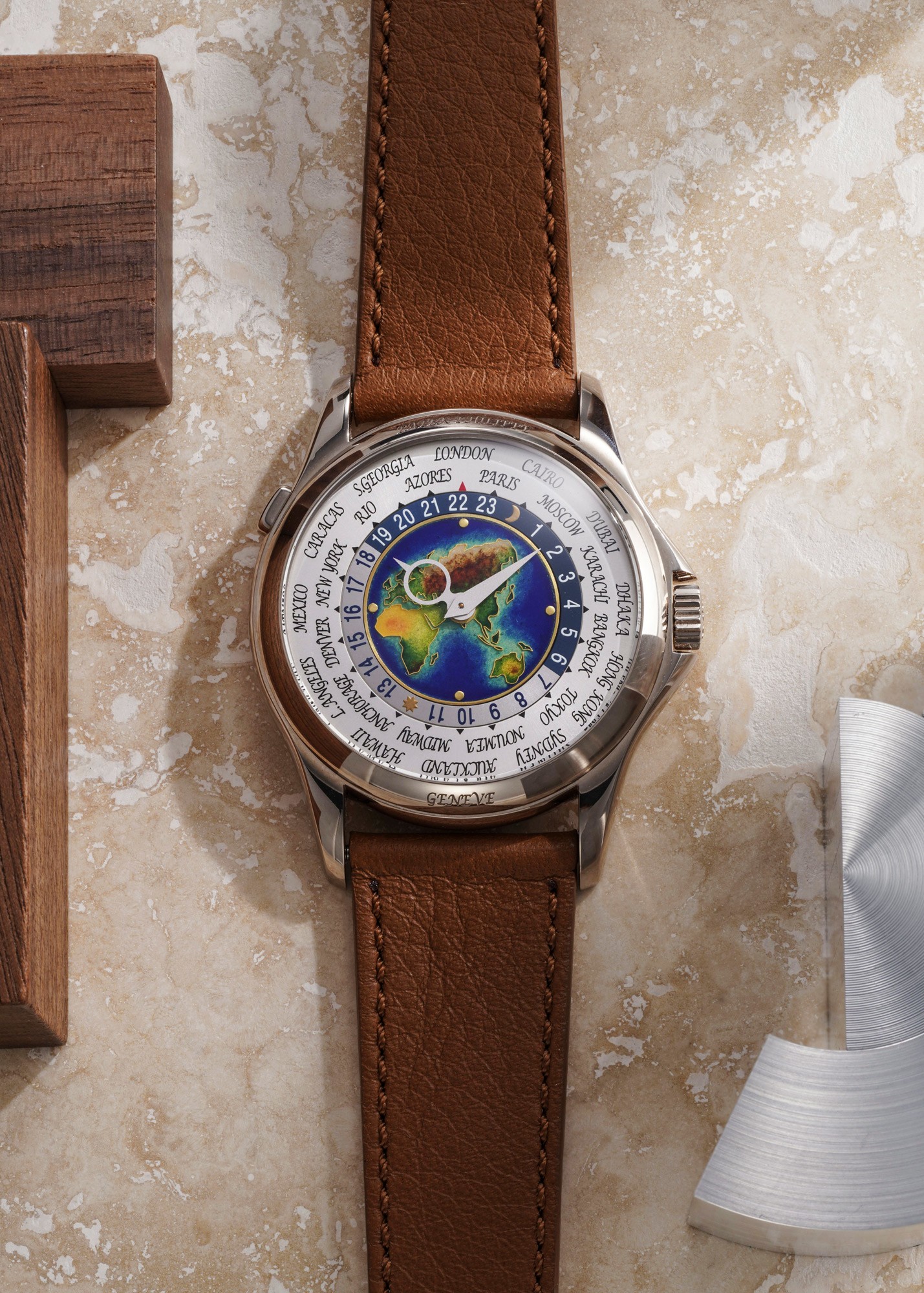 <p><strong>PATEK PHILIPPE</strong>&nbsp;<em>A very fine and attractive white gold world time wristwatch with cloisonn&eacute; enamel dial, certificate of origin and presentation box</em></p>
