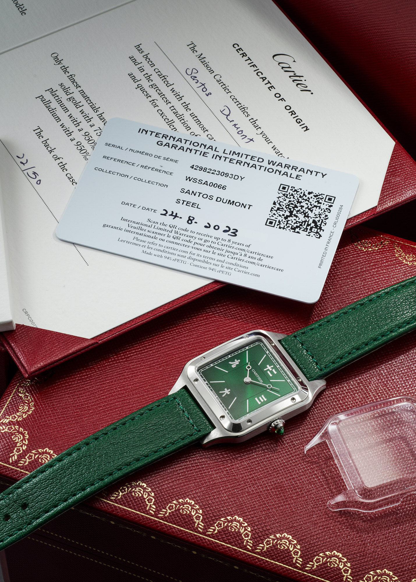 <p><strong>CARTIER</strong>&nbsp;<em>An extremely rare, unusual and attractive limited edition stainless steel wristwatch with sunburst green dial, Chinese numerals, emerald-set crown, certificate and presentation box</em></p>
