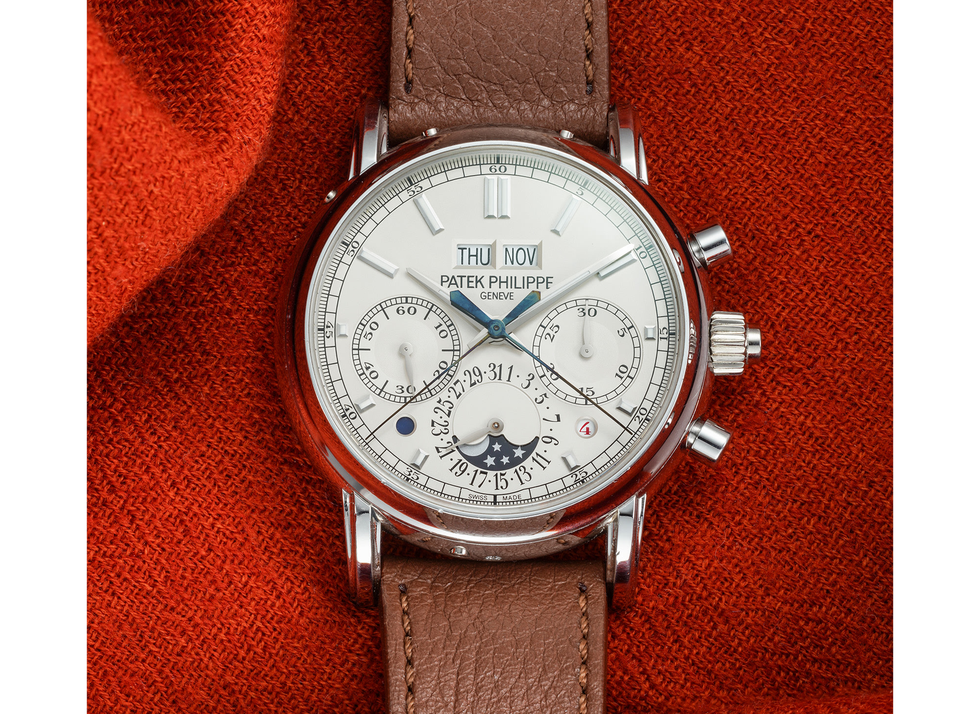 <p><strong>PATEK PHILIPPE</strong>&nbsp;<em>reference 5204P-010. A very fine and attractive platinum perpetual calendar split-seconds chronograph wristwatch with moon phases, leap year, day and night indication, certificate of origin and presentation box</em></p>

