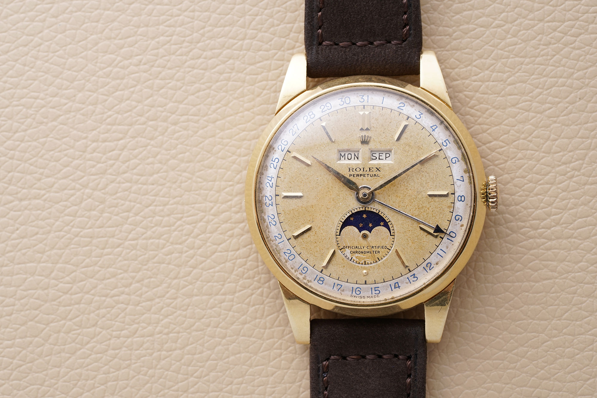 A spectacular yellow gold Rolex triple calendar reference 8171 with moonphases and two-tone dial