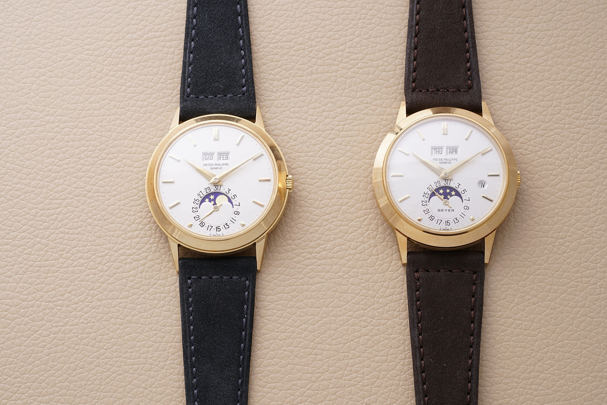 Left, an incredibly well-preserved yellow gold Patek Philippe reference 3448 perpetual calendar, and right, an equally impressive yellow gold Patek Philippe reference 3450 perpetual calendar with leap year indication, and Beyer-signed dial