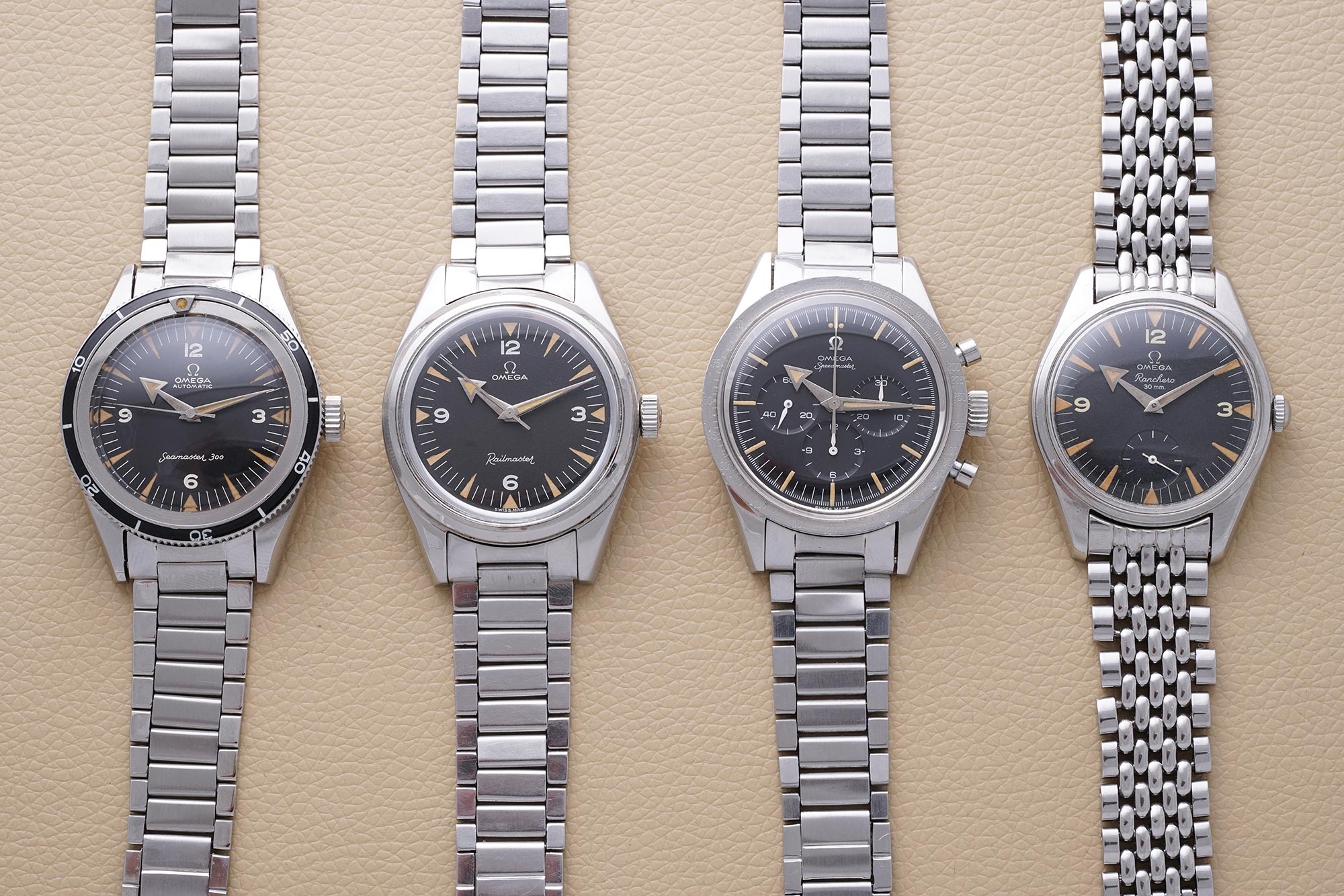 An Omega Seamaster Ref. 2913-3, Railmaster Ref. 2914-1, Speedmaster Ref.  2915-2 and a Ranchero Ref. 2990 with 'Broad Arrow' hands