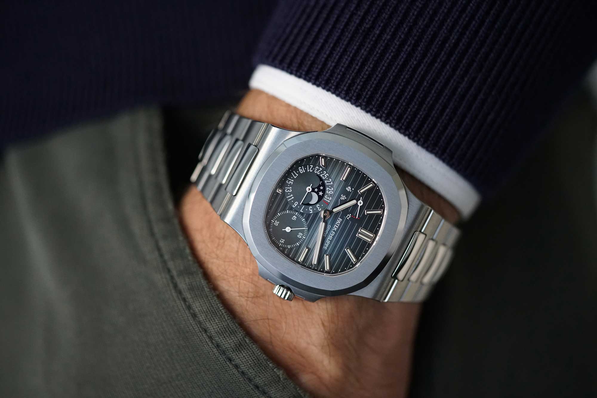 A very well preserved stainless steel Patek Philippe Nautilus reference 5712 with date, power reserve indication, moon&nbsp; phases and bracelet, sold with original certificate and box