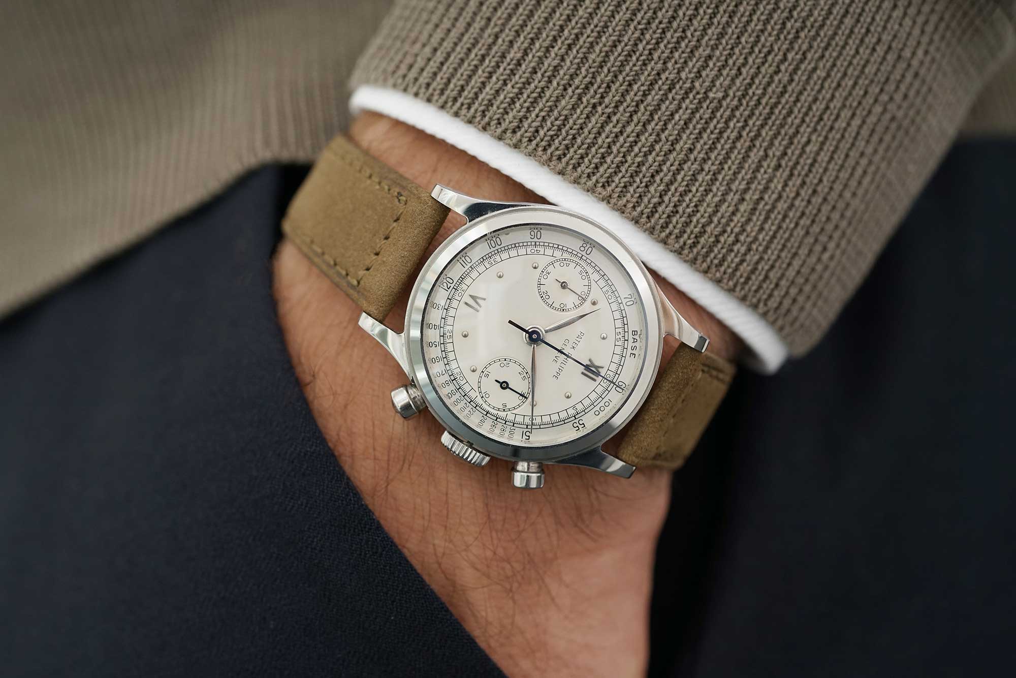 A fine and rare stainless steel Patek Philippe reference 1463 chronnograph with two-tone silvered dial with outer tachymeter scale