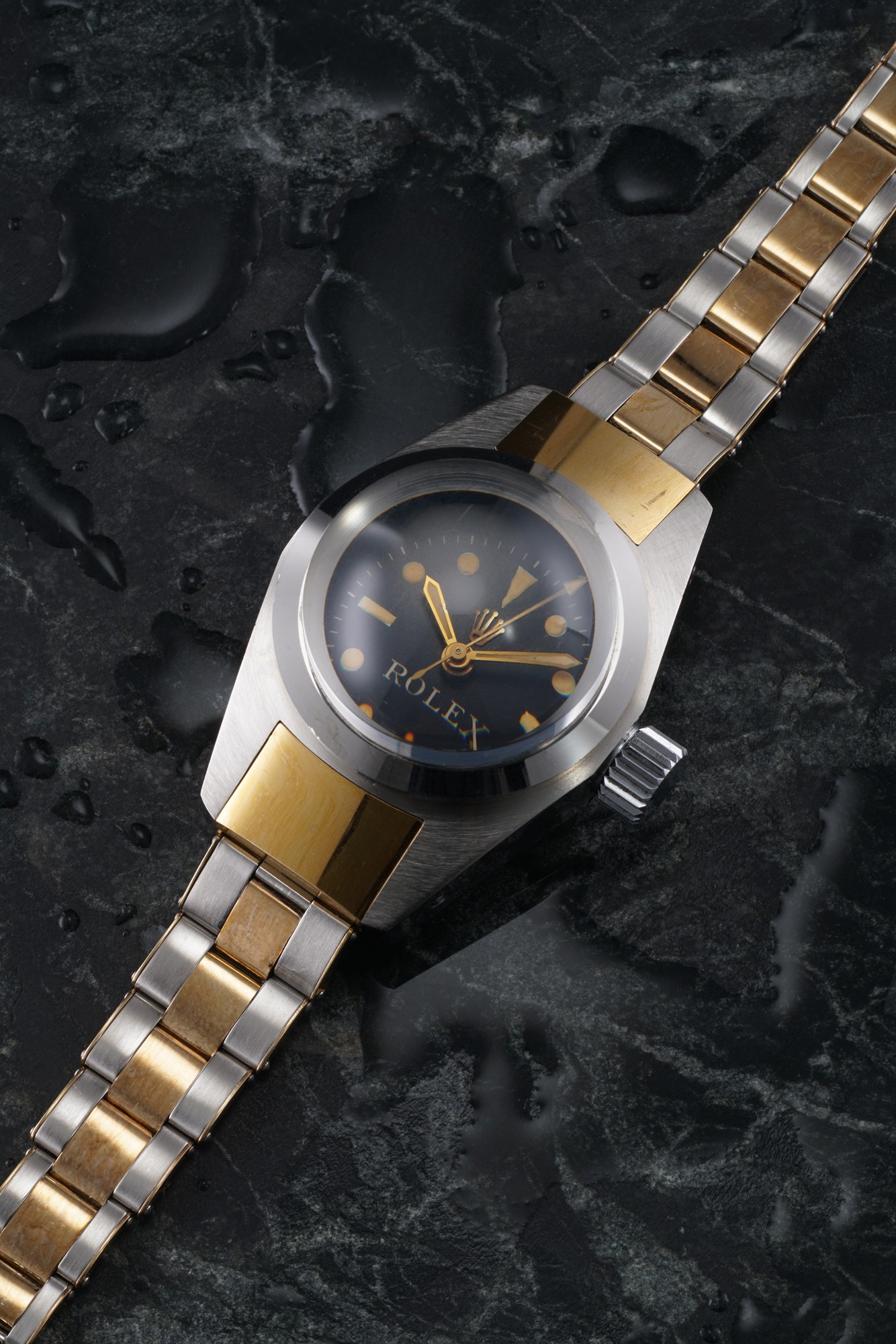 <p><strong>ROLEX</strong> A historically important, extraordinary and museum quality stainless steel and gold ultra-deep dive wristwatch with center seconds, made in 1965.</p>
