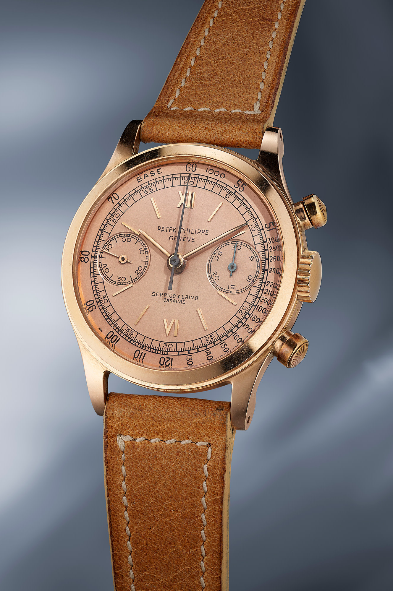 An incredibly attractive and rare pink gold Patek Philippe Reference chronograph 1463 with pink dial signed Serpico Y Laino
