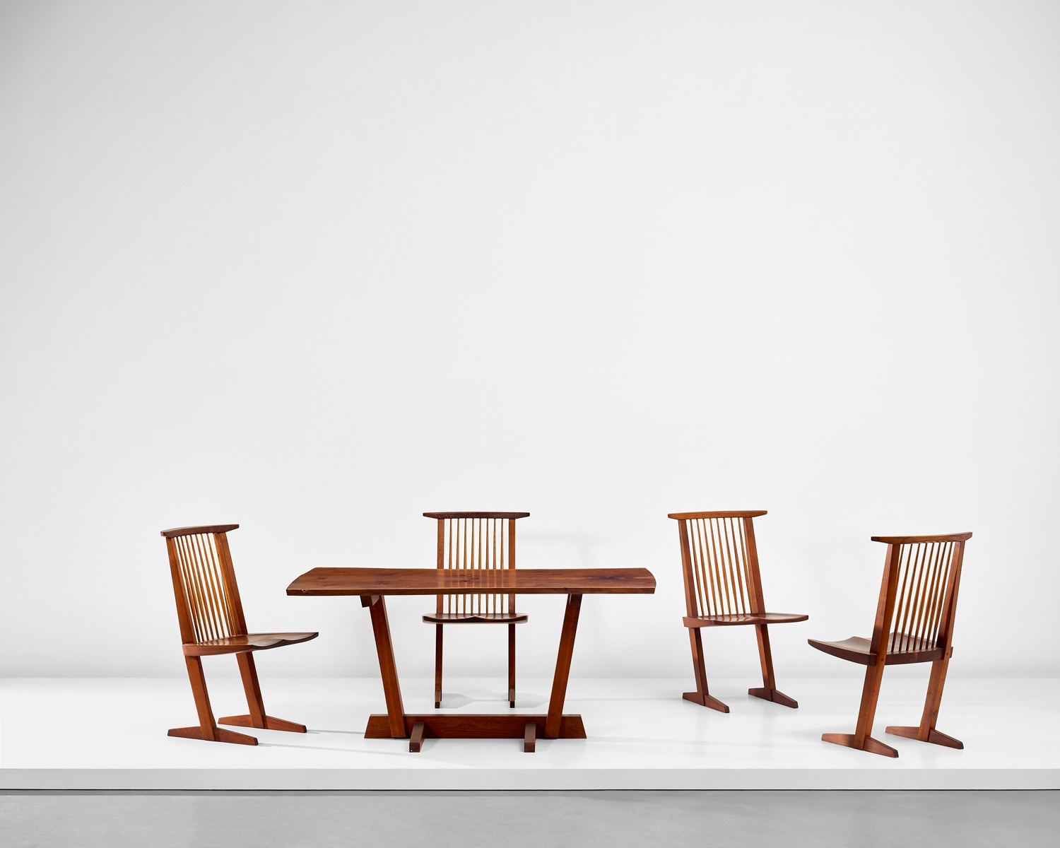 <p><strong>GEORGE NAKASHIMA<em> </em></strong><em>Set of four 'Conoid' dining chairs and 'Conoid' dining table</em></p>