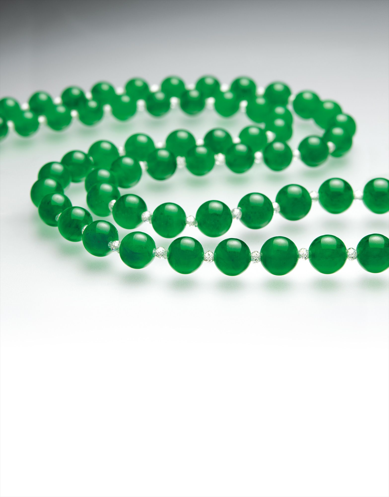 A Fine Jadeite Bead and Diamond Bead Necklace