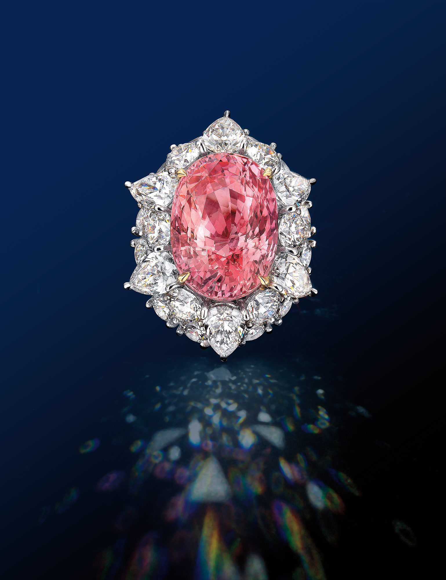 A Padparadscha Sapphire and Diamond Ring