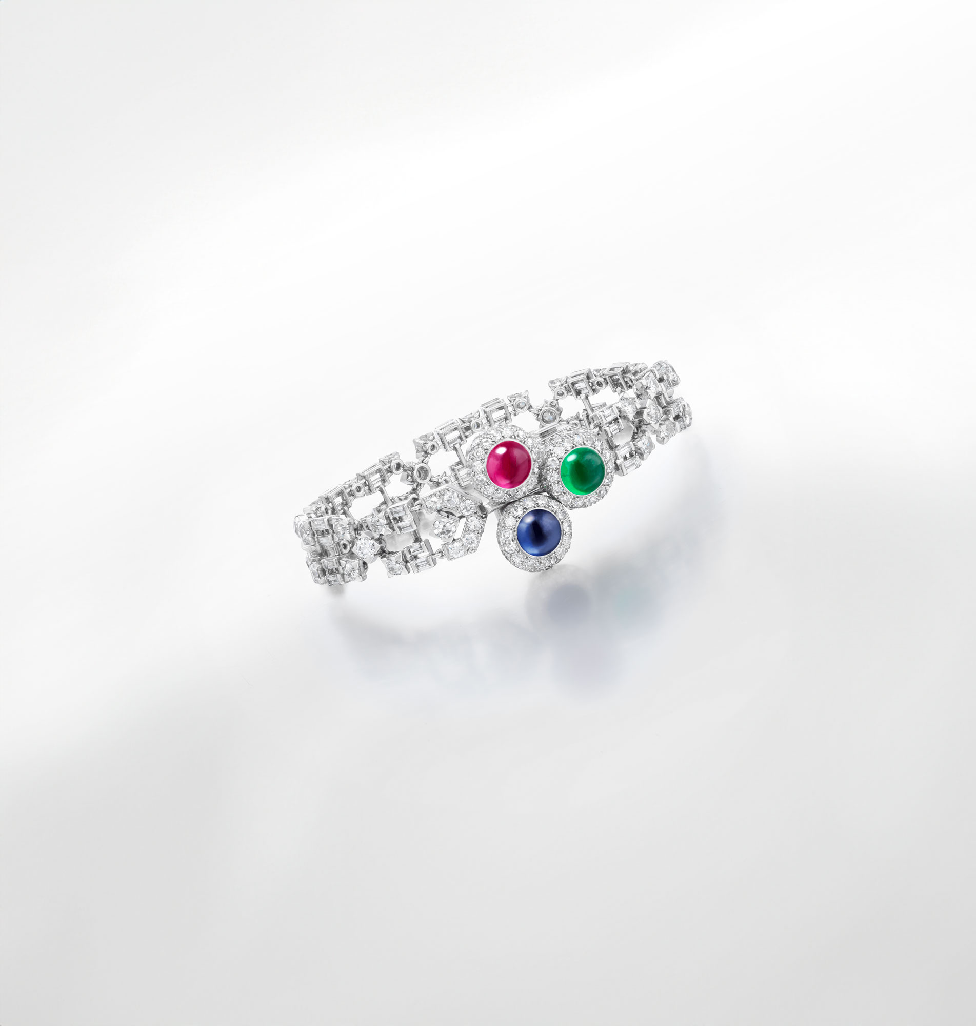 <p><strong>CARTIER</strong> <em>Art Deco Ruby, Emerald, Sapphire and Diamond Bracelet</em>, 1931</p>