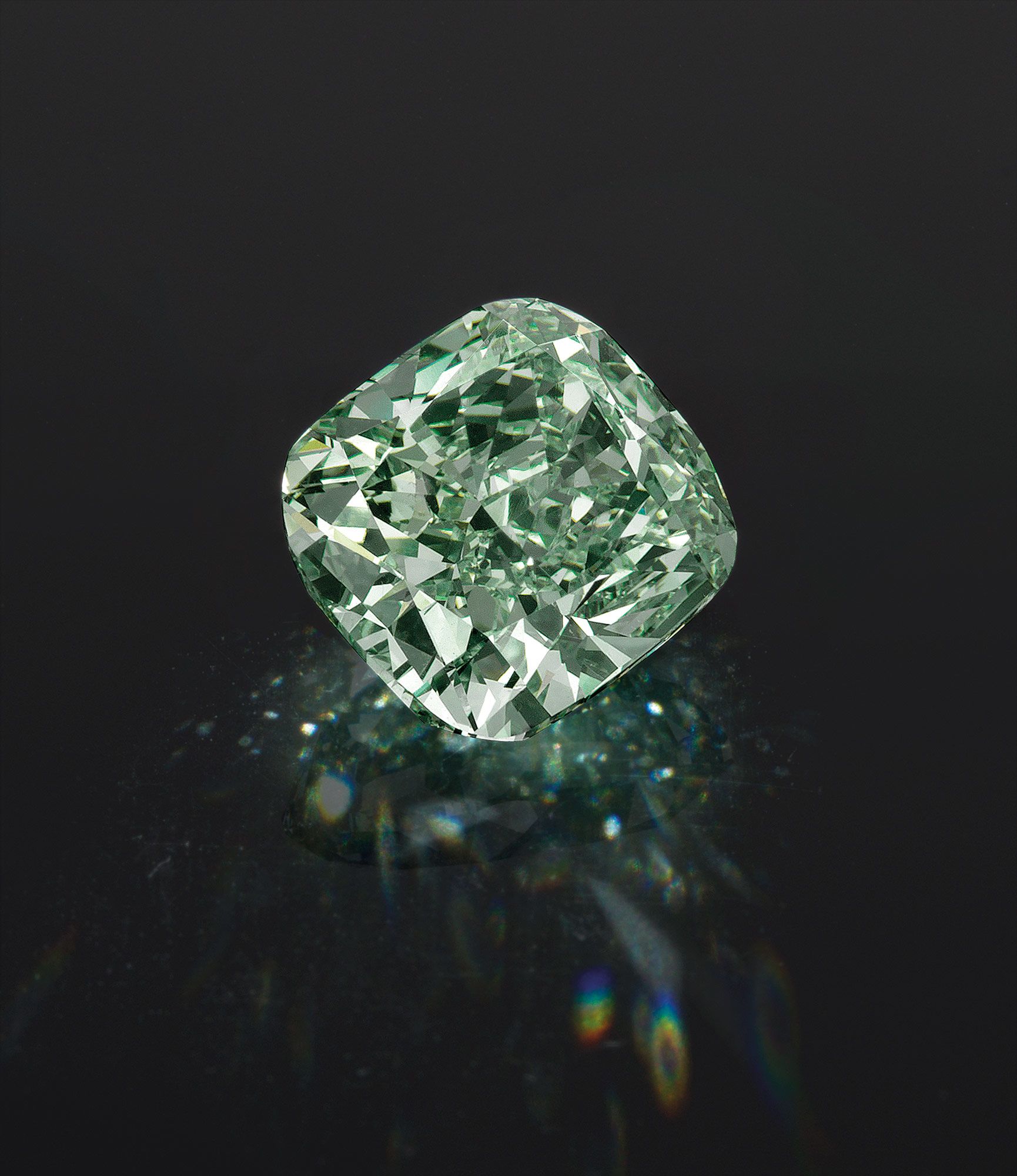 A Rare and Fine Fancy Intense Green Diamond and Diamond Ring<br />