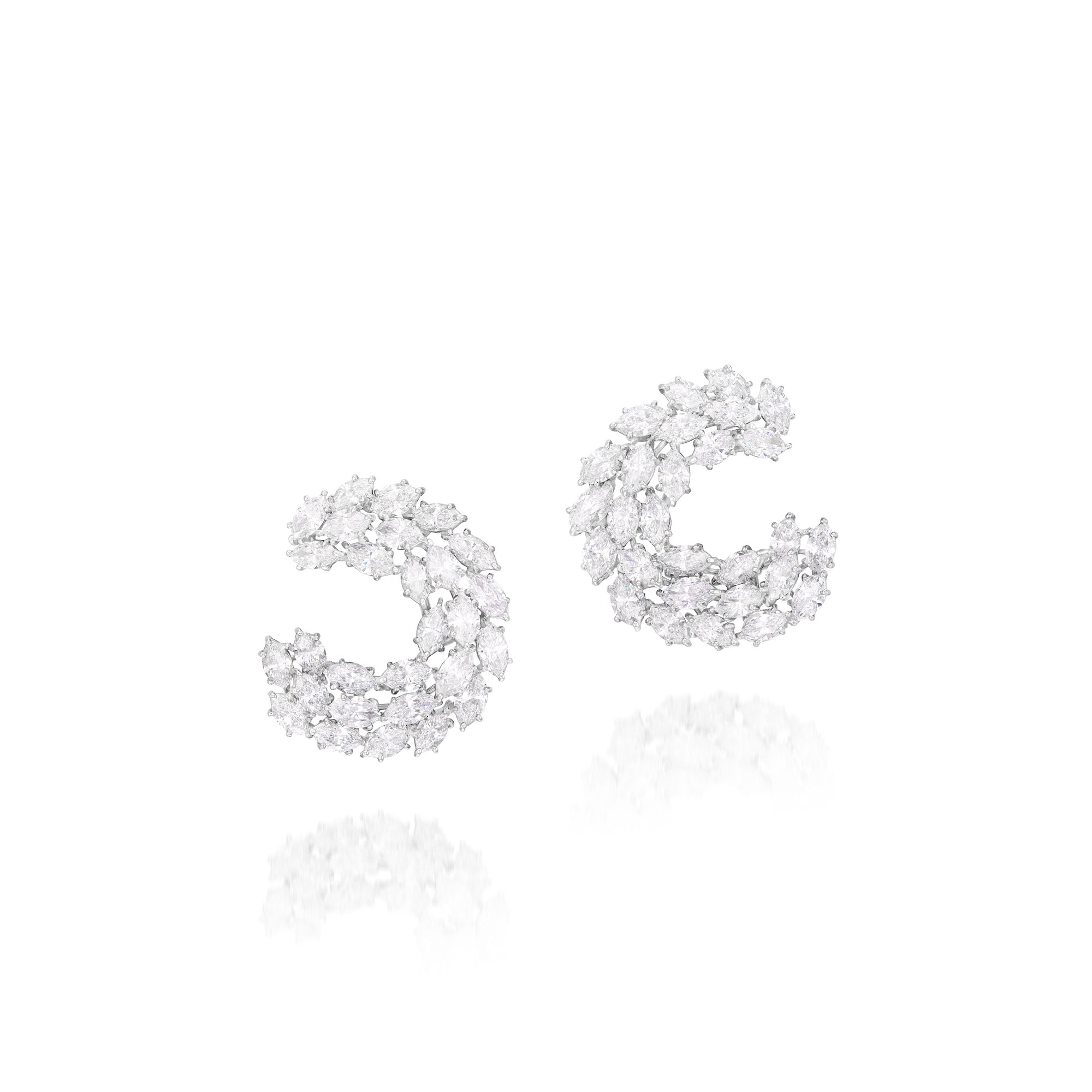 <p><strong>HARRY WINSTON</strong> <em>Diamond Ear Clips</em></p>