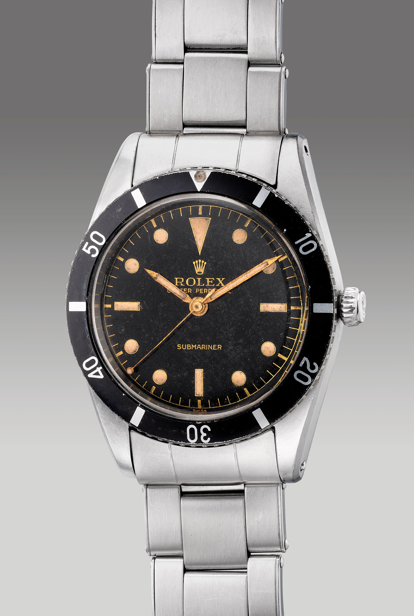 <p><strong>ROLEX&nbsp;</strong>reference 6204, a very fine, early and well-preserved stainless steel diver&rsquo;s center seconds&nbsp;wristwatch with &ldquo;gilt&rdquo; dial and bracelet, circa 1954</p>
