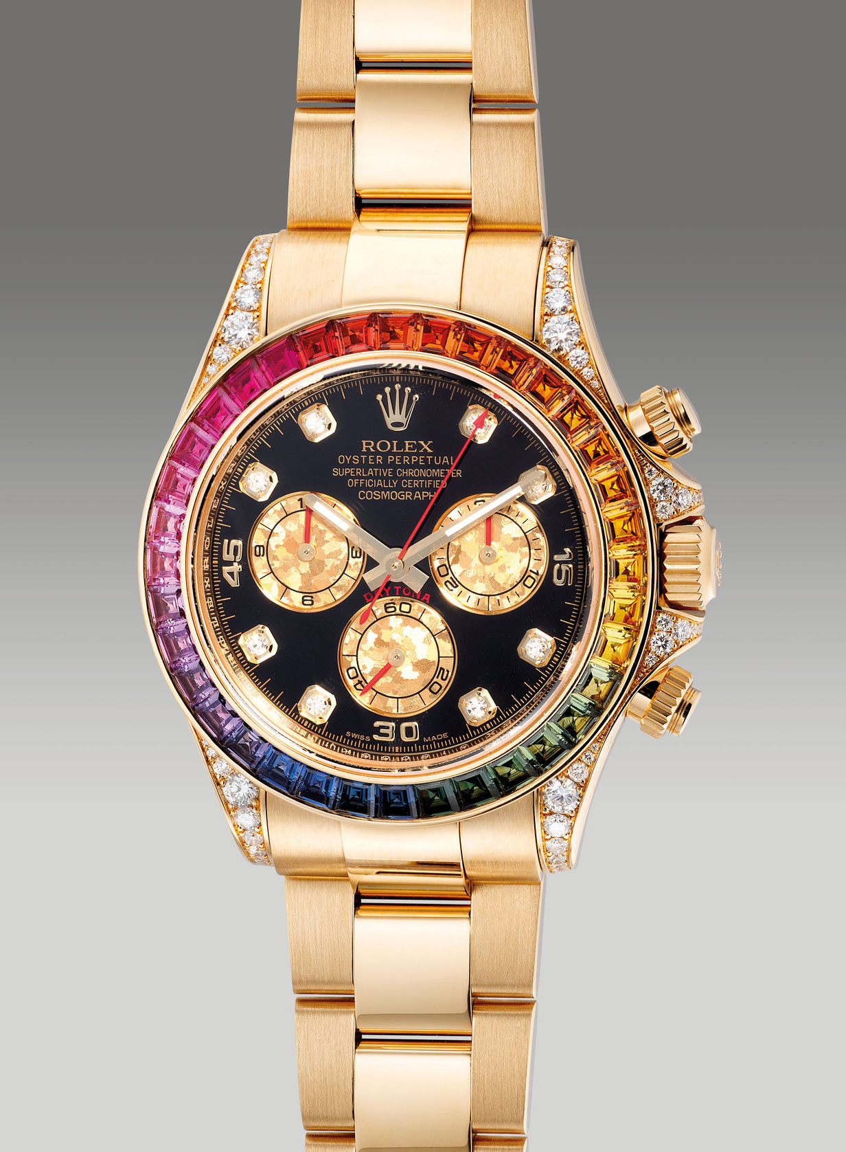 <p><strong>ROLEX</strong> reference 116598RBOW, a very fine, attractive and rare yellow gold diamond and rainbow-colored sapphire-set chronograph wristwatch with bracelet, guarantee and box, circa &nbsp;2012</p>
