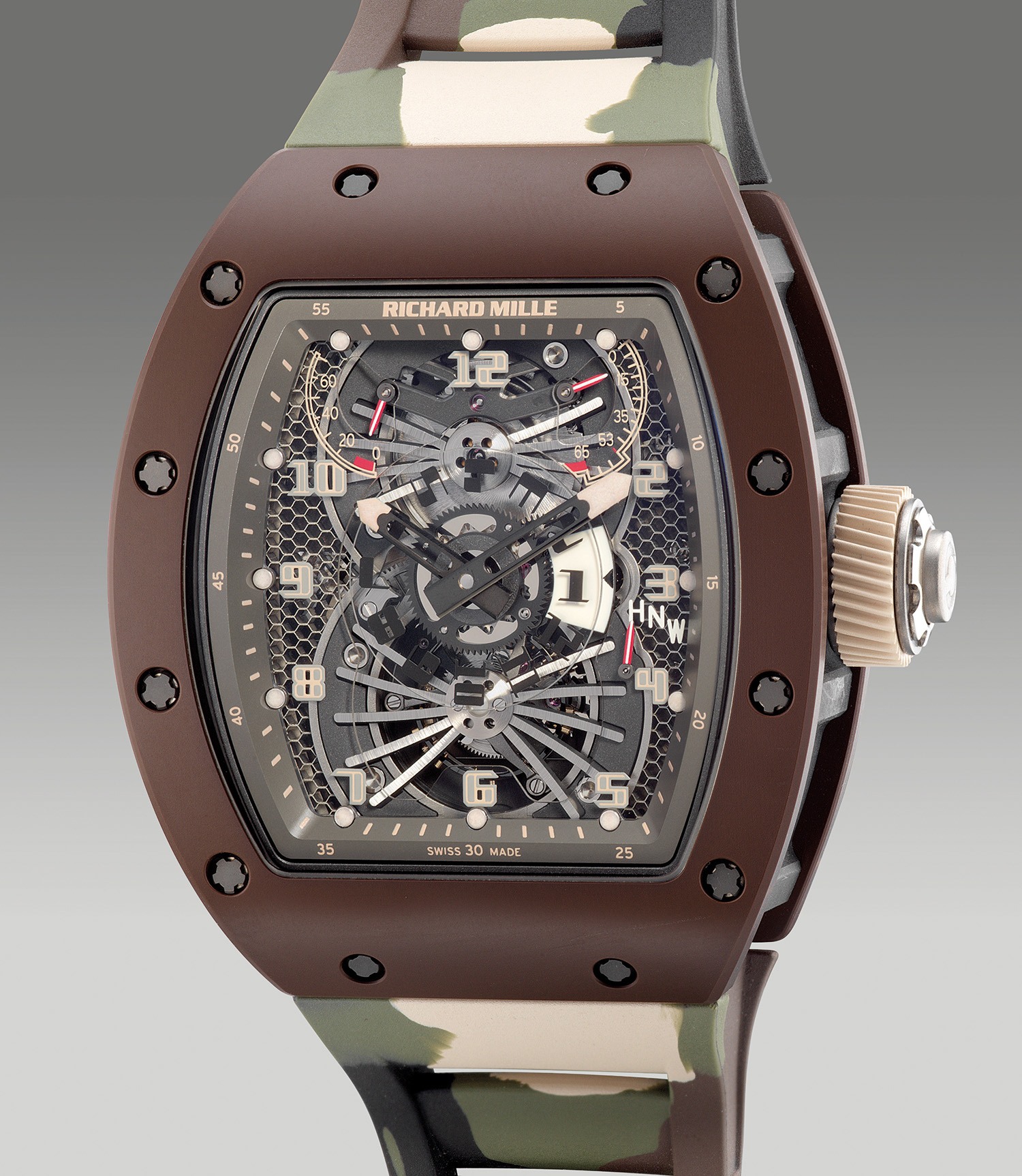 <p><strong>RICHARD MILLE</strong> - RM022 - An attractive and very rare limited edition brown ceramic, carbon TPT tonneau-shaped dual-time, tourbillon, with function selector, power reserve and torque indication, original warranty and presentation box, numbered 05 of a limited edition of 10 pieces, circa 2018</p>
