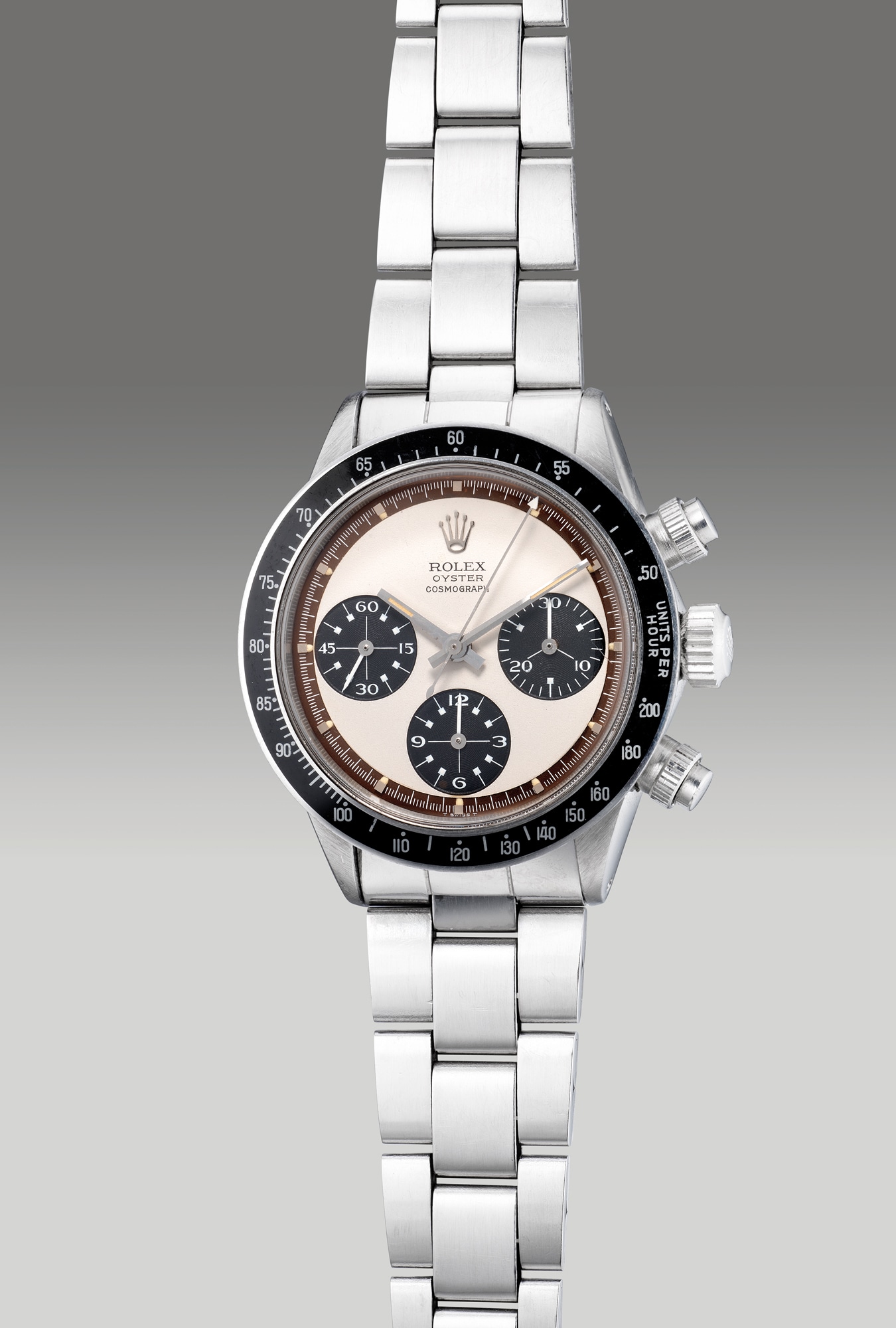 <p><strong>ROLEX</strong>, Ref. 6263, A fine, rare and highly attractive stainless steel chronograph wristwatch with “Paul Newman” dial, “tropical” outer minute track, bracelet and guarantee, Circa 1971</p>