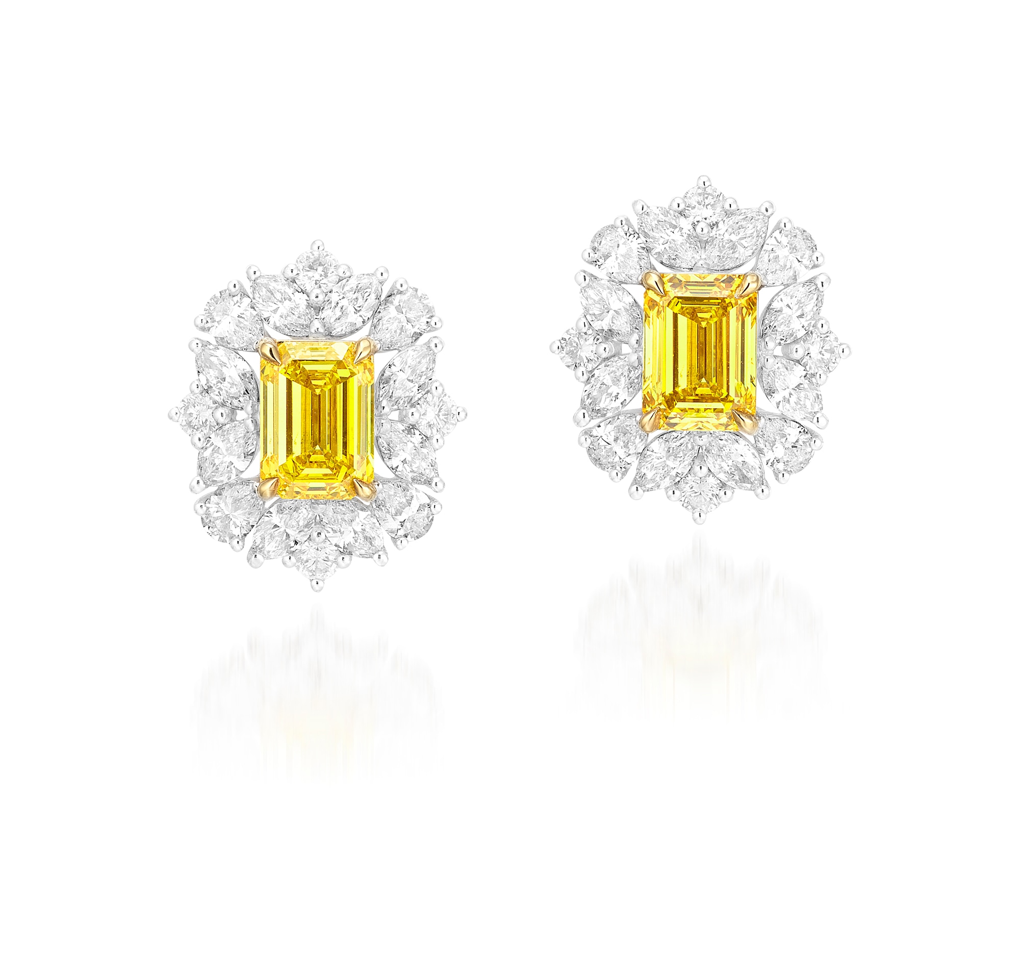 <p>A Pair of 1.01 and 1.01 carat Fancy Vivid Yellow Diamond and Diamond Earrings</p>