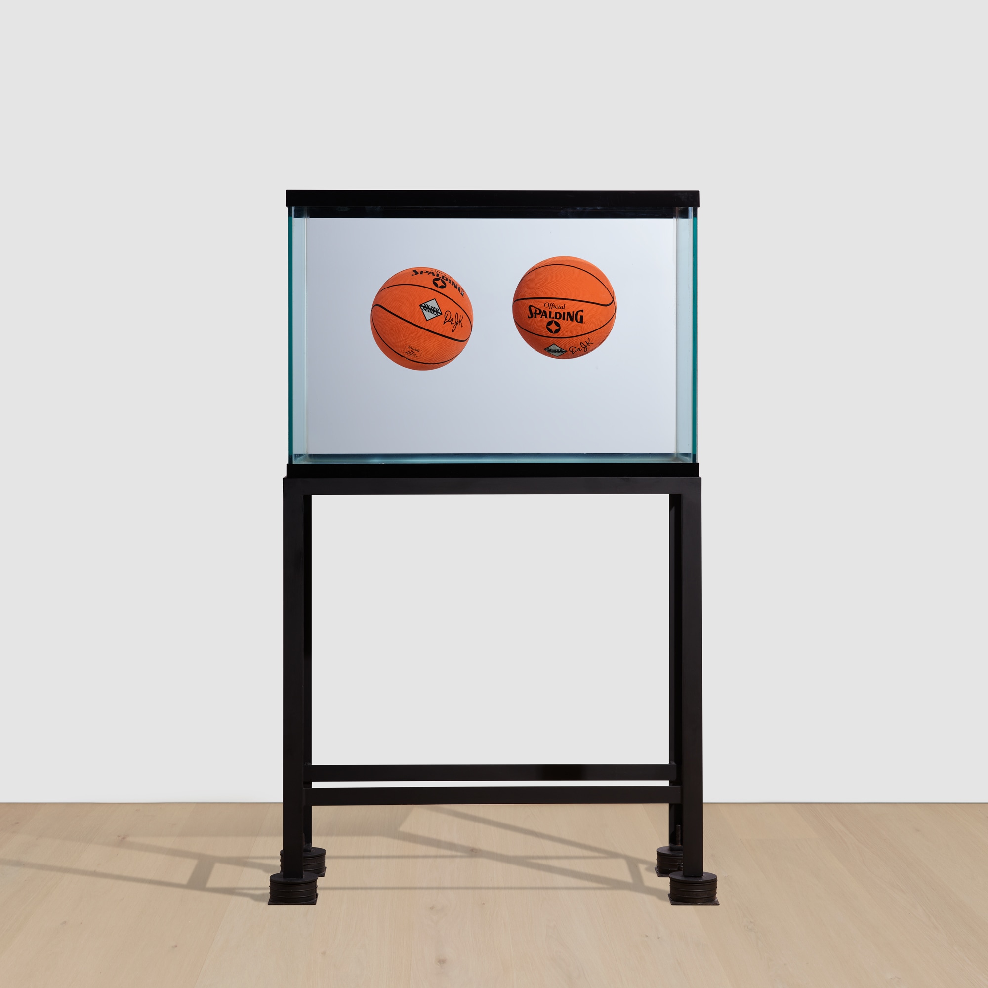 <p><strong>JEFF KOONS</strong> <em>Two Ball Total Equilibrium Tank (Spalding Dr. J Silver Series)</em>, 1985</p>