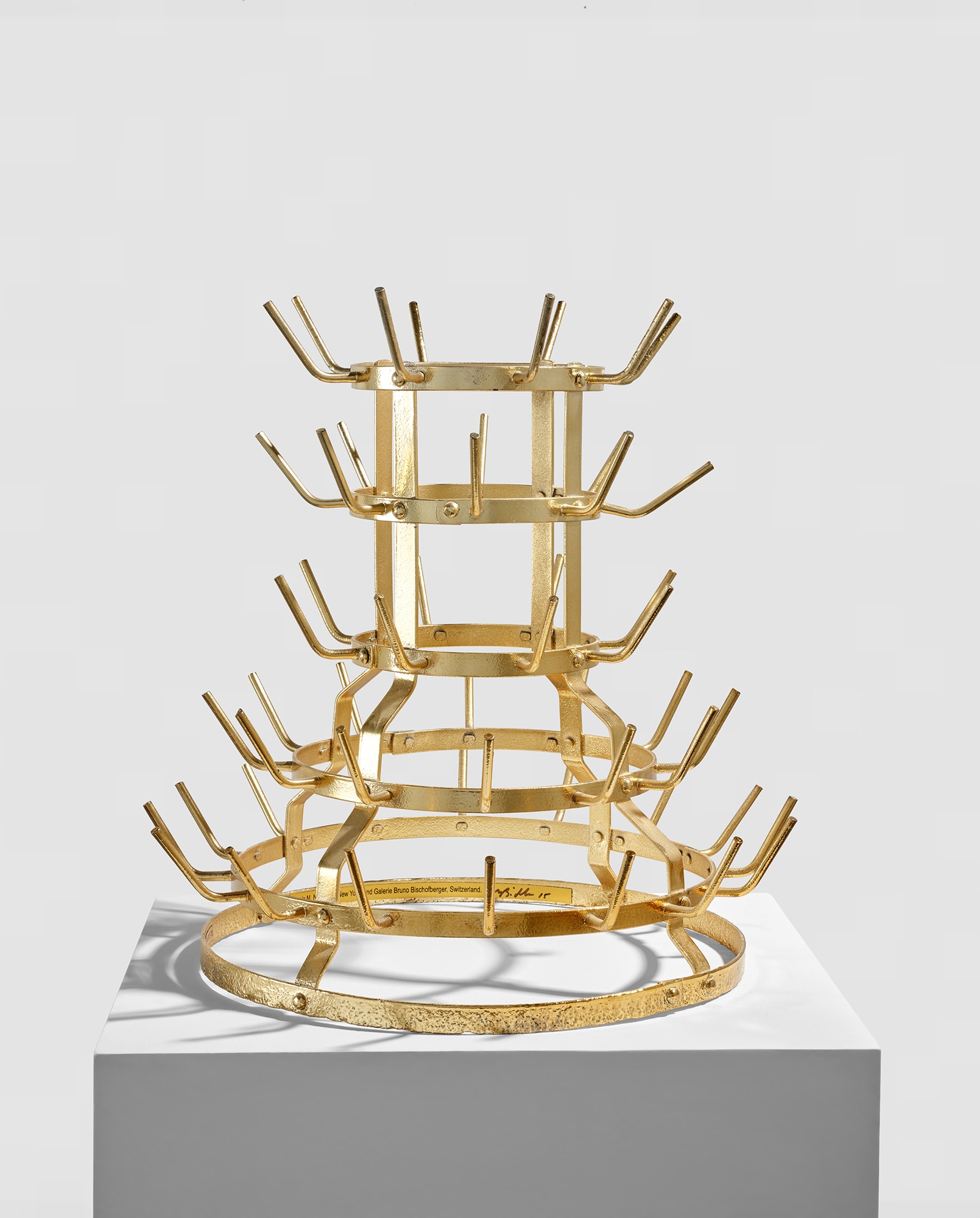 <p><strong>MIKE BIDLO</strong> <em>Gilded Bottle Rack (Not Duchamp Bottle Rack 1914),</em> $10,000&ndash;12,000</p>
