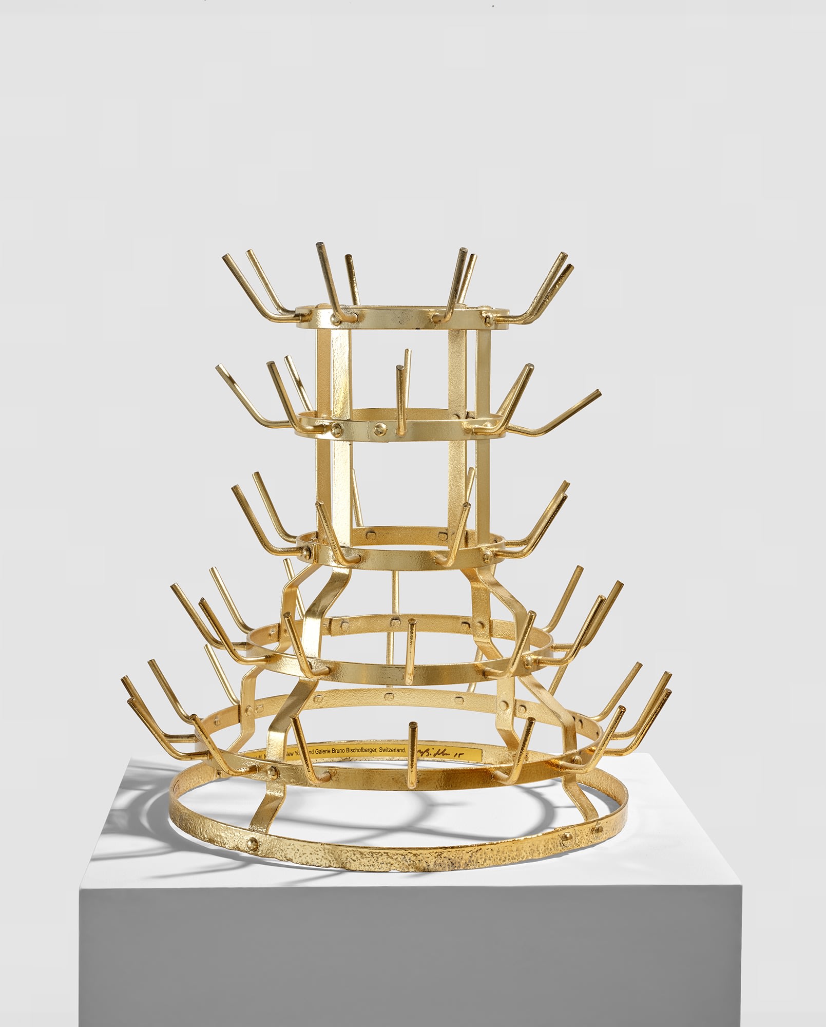 <p><strong>MIKE BIDLO</strong> <em>Gilded Bottle Rack (Not Duchamp Bottle Rack 1914),</em> $10,000&ndash;15,000</p>
