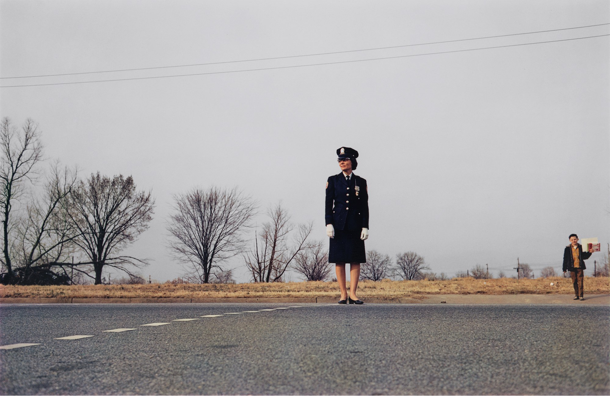 <p><strong>WILLIAM EGGLESTON</strong> <em>Untitled (crossing guard), </em>circa 1970-1974</p>