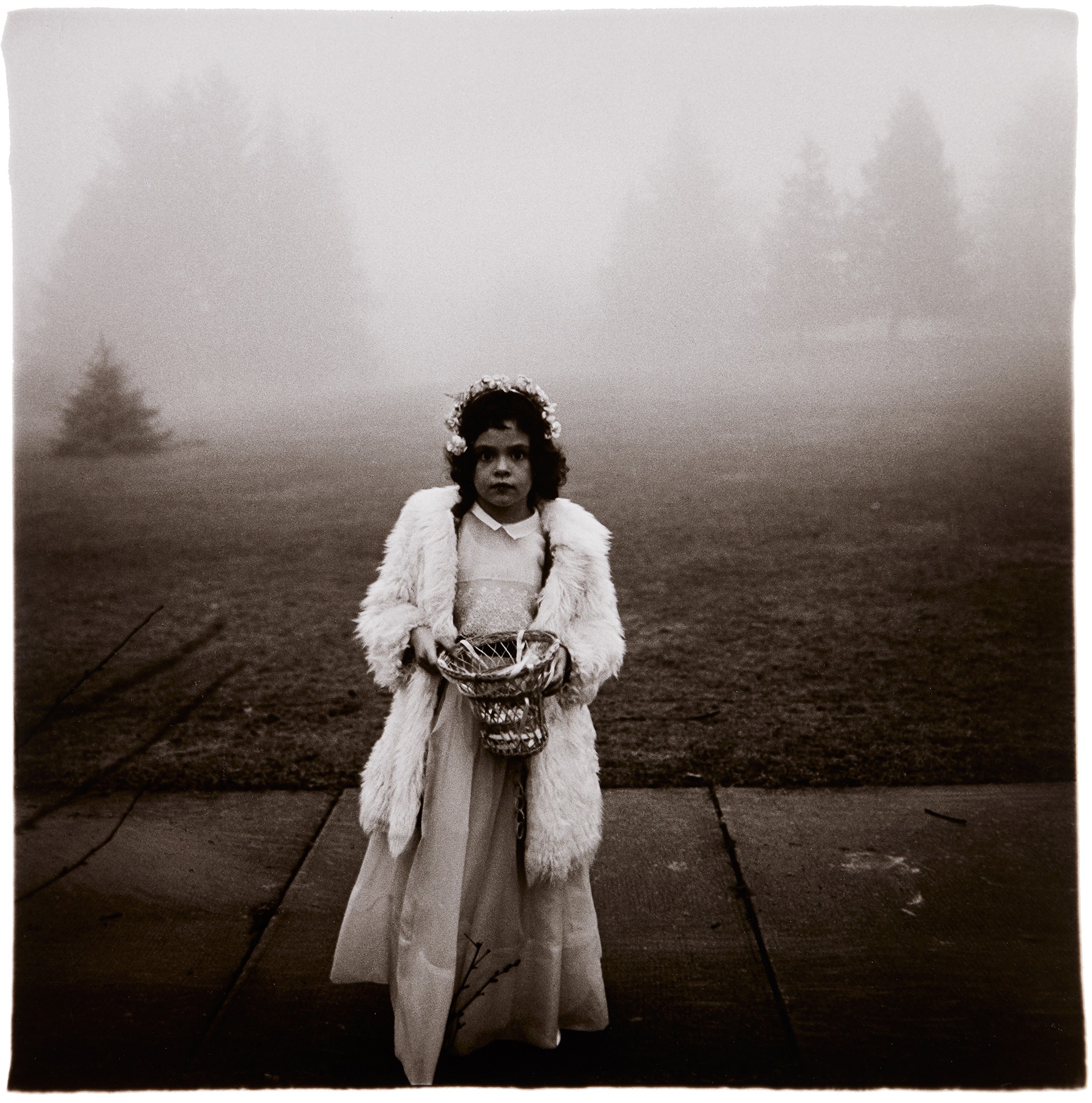 <p><strong>DIANE ARBUS<em> </em></strong><em>A Flower Girl at a Wedding, Conn</em>., 1964</p>