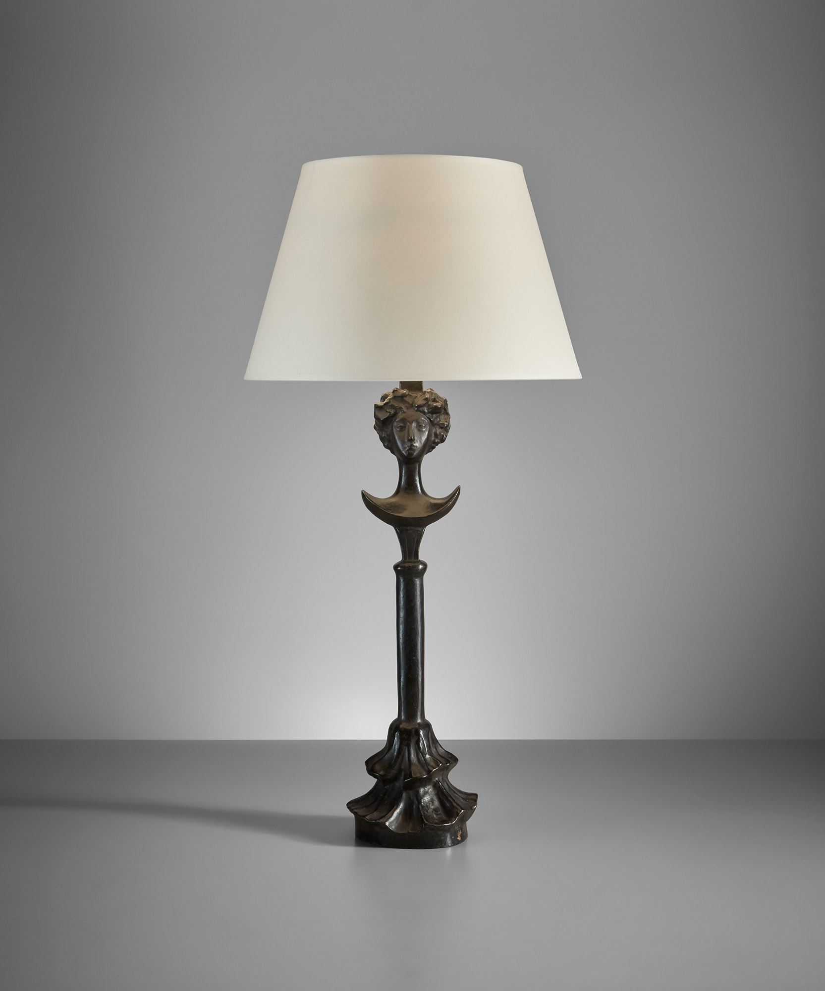 <p><strong>ALBERTO GIACOMETTI</strong> <em>Tête de femme table lamp</em>, designed circa 1933, later cast</p>