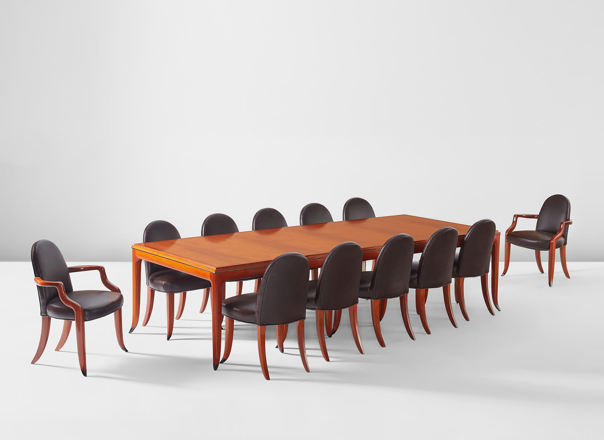 <p><strong>WENDELL CASTLE </strong><em>Table and twelve chairs </em></p>