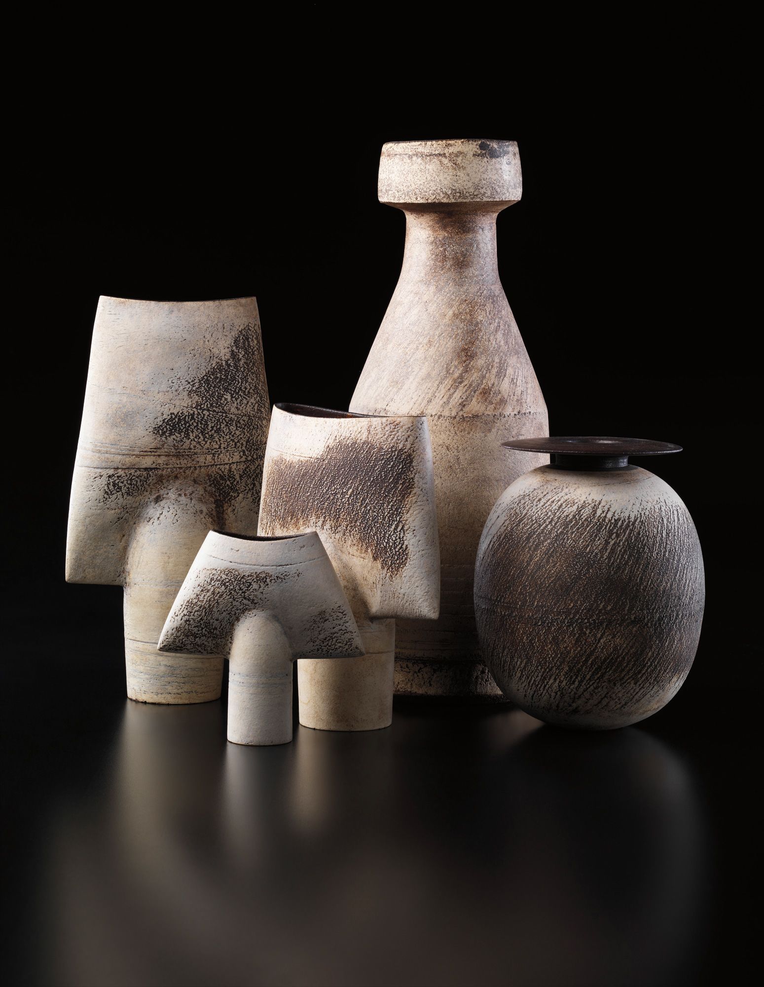 <b>HANS COPER</b> <i>Three 'Spade' forms, a large bottle, and an ovoid and disc form</i>, circa 1958-1972