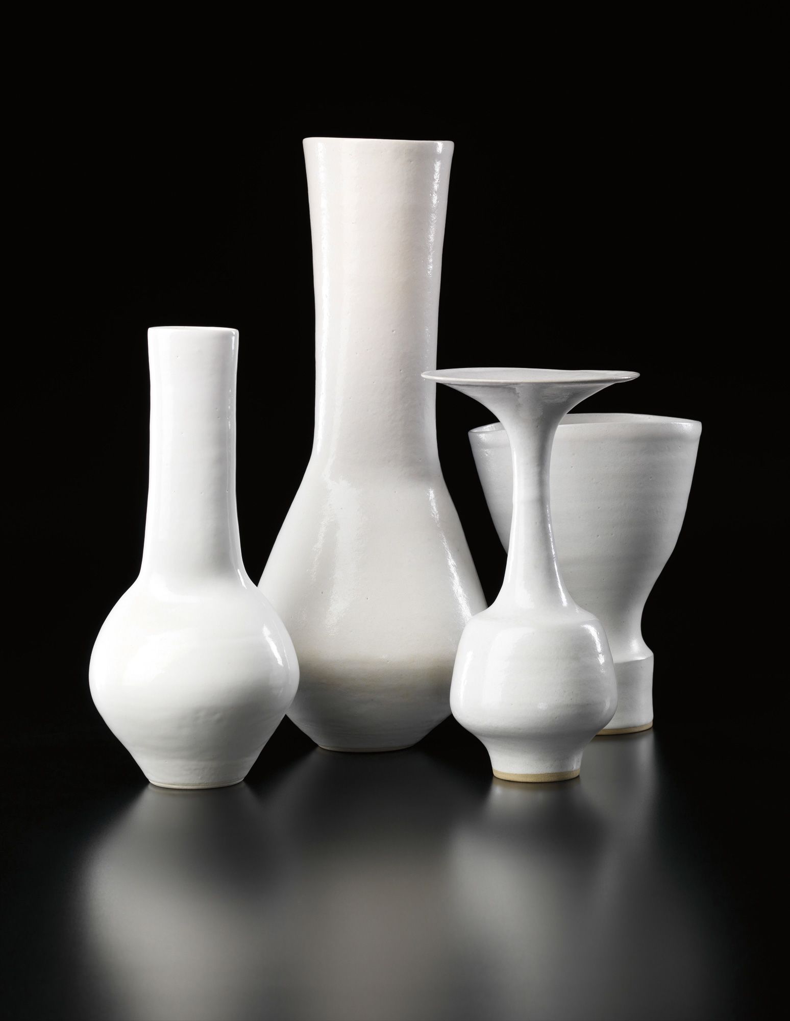 <b>LUCIE RIE </b><i>Three composite vases and a bottle with flaring lip</i>, circa 1968-1980