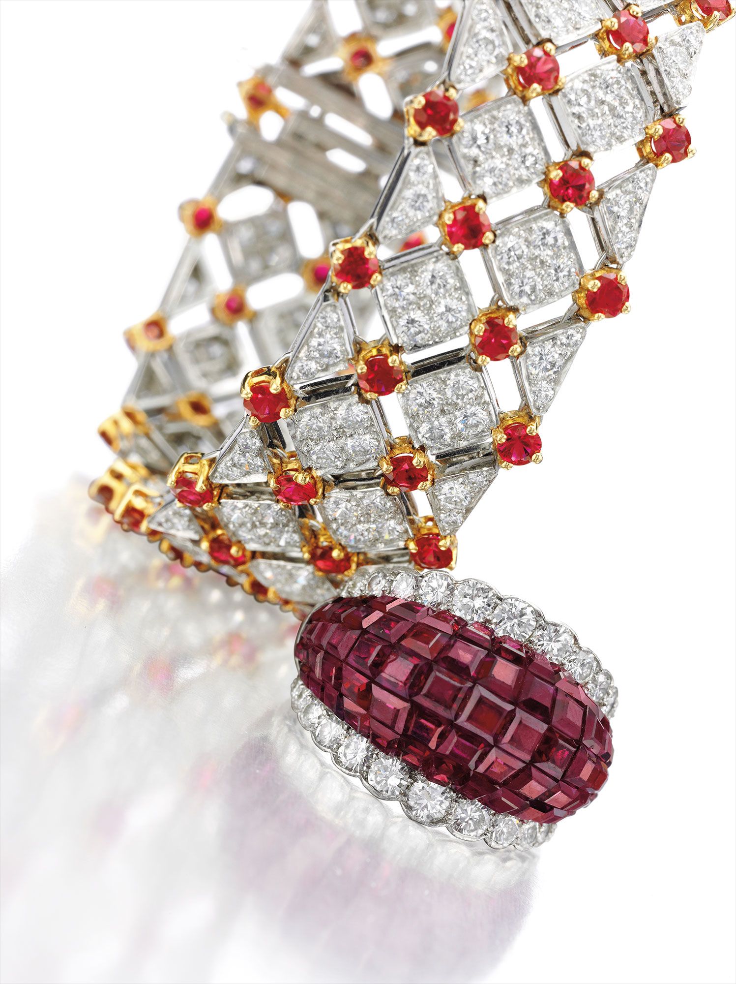 (Top) <b>TIFFANY & CO.</b> <i>An Impressive Diamond and Ruby 'Trellis' Bracelet </i>and<i> </i>(Bottom) <b>VAN CLEEF & ARPELS</b><i> A 'Mystery-Set' Ruby and Diamond Ring</i>