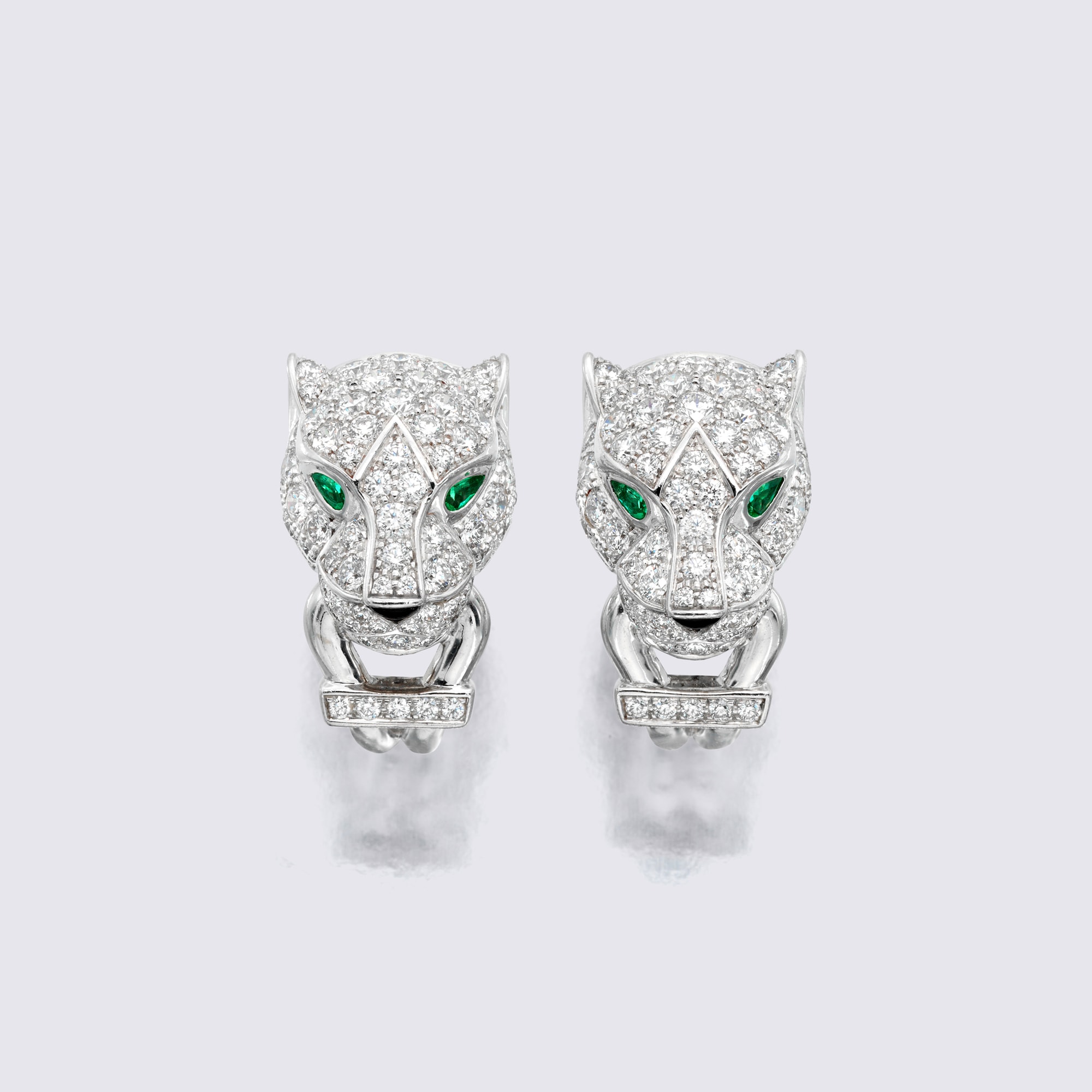 <p><strong>CARTIER</strong> <em>Emerald, Onyx and Diamond Earrings, ‘Panthere’</em></p>