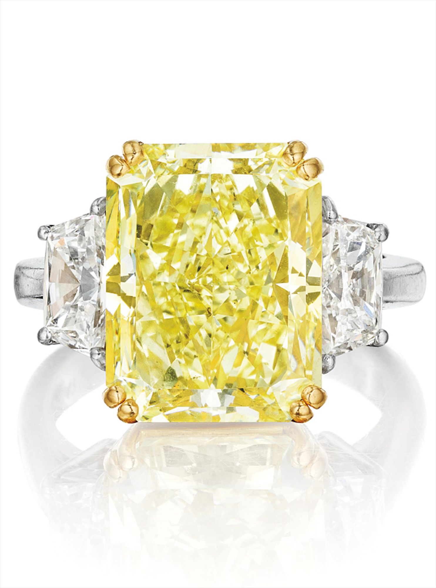 A Magnificent Fancy Yellow Diamond and Diamond Ring, <i>Cartier</i>
