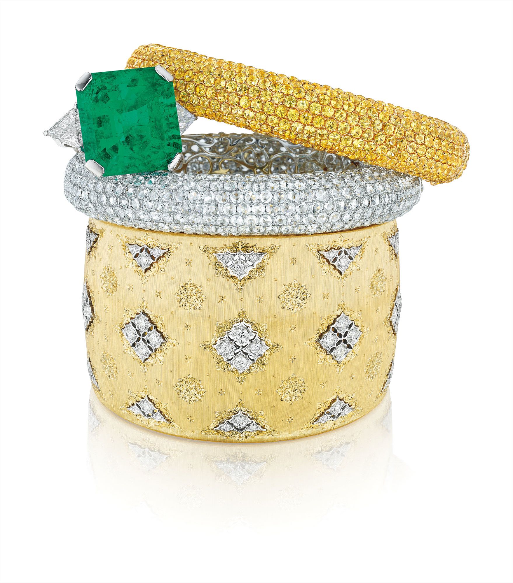 A Superb Colombian Emerald and Diamond Ring; An Impressive Set of Diamond and Yellow Sapphire Bangle Bracelets; and A Gold and Diamond Cuff, <i>Buccellati </i>