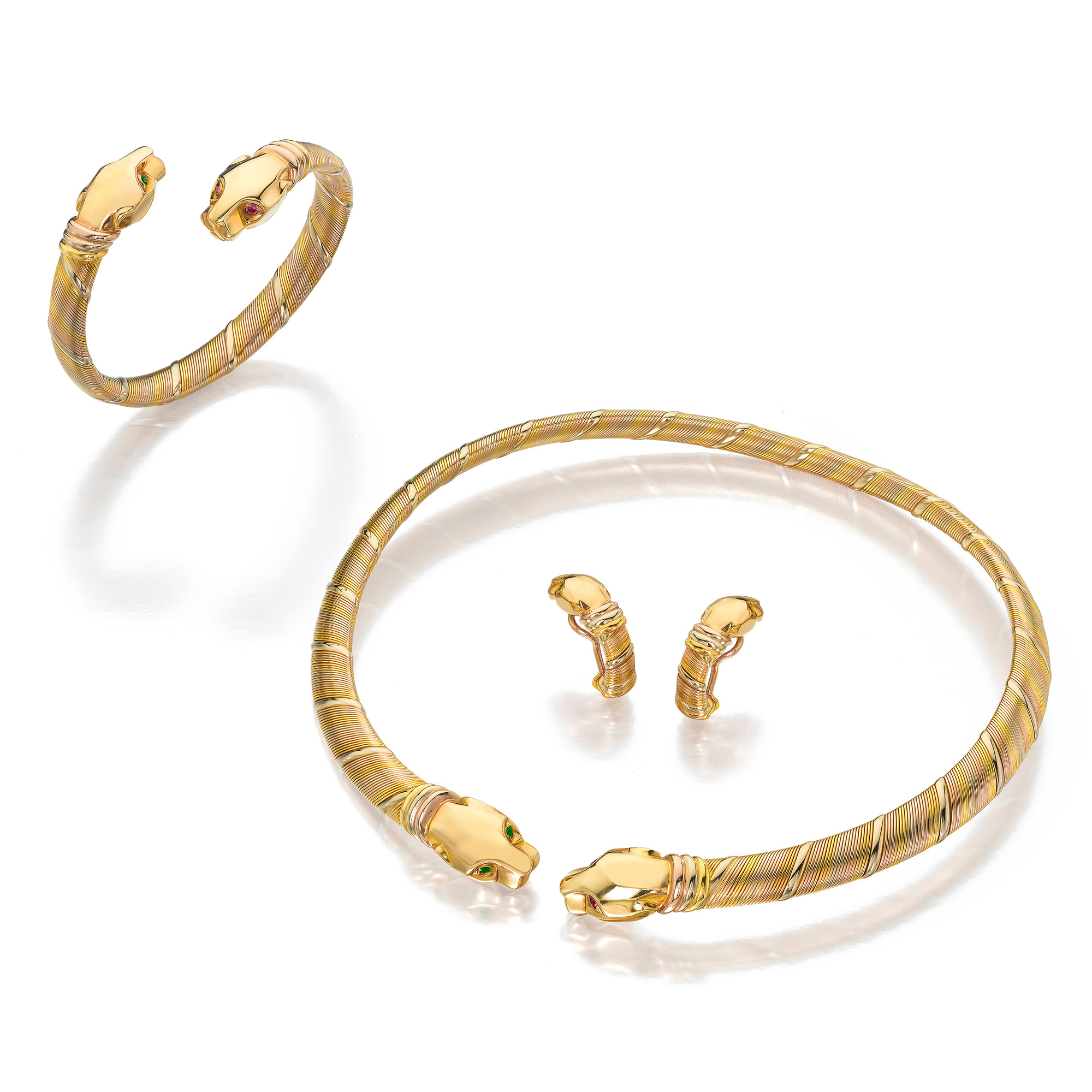 <p><strong>Cartier.</strong> A Suite of Emerald, Ruby, and Tri-Colored Gold Jewelry</p>