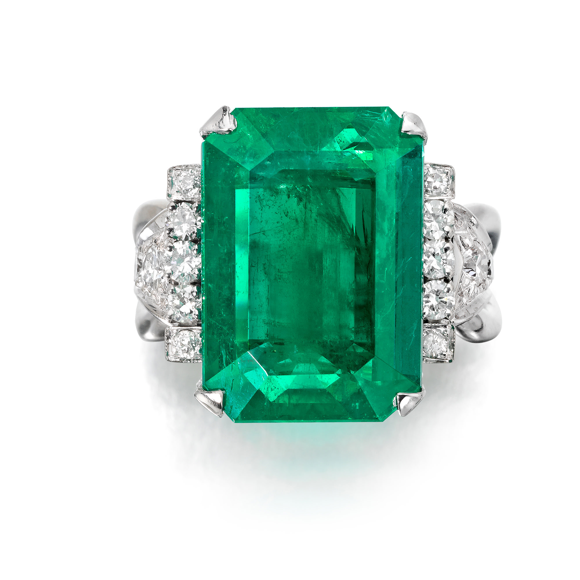 <p>An Emerald, Diamond, and White Gold Ring</p>