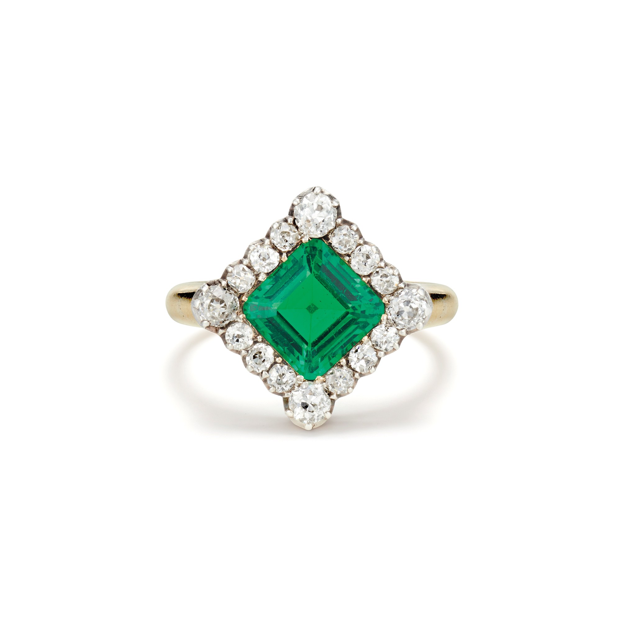 An Antique Emerald, Diamond, Gold and Silver Topped Gold Ring