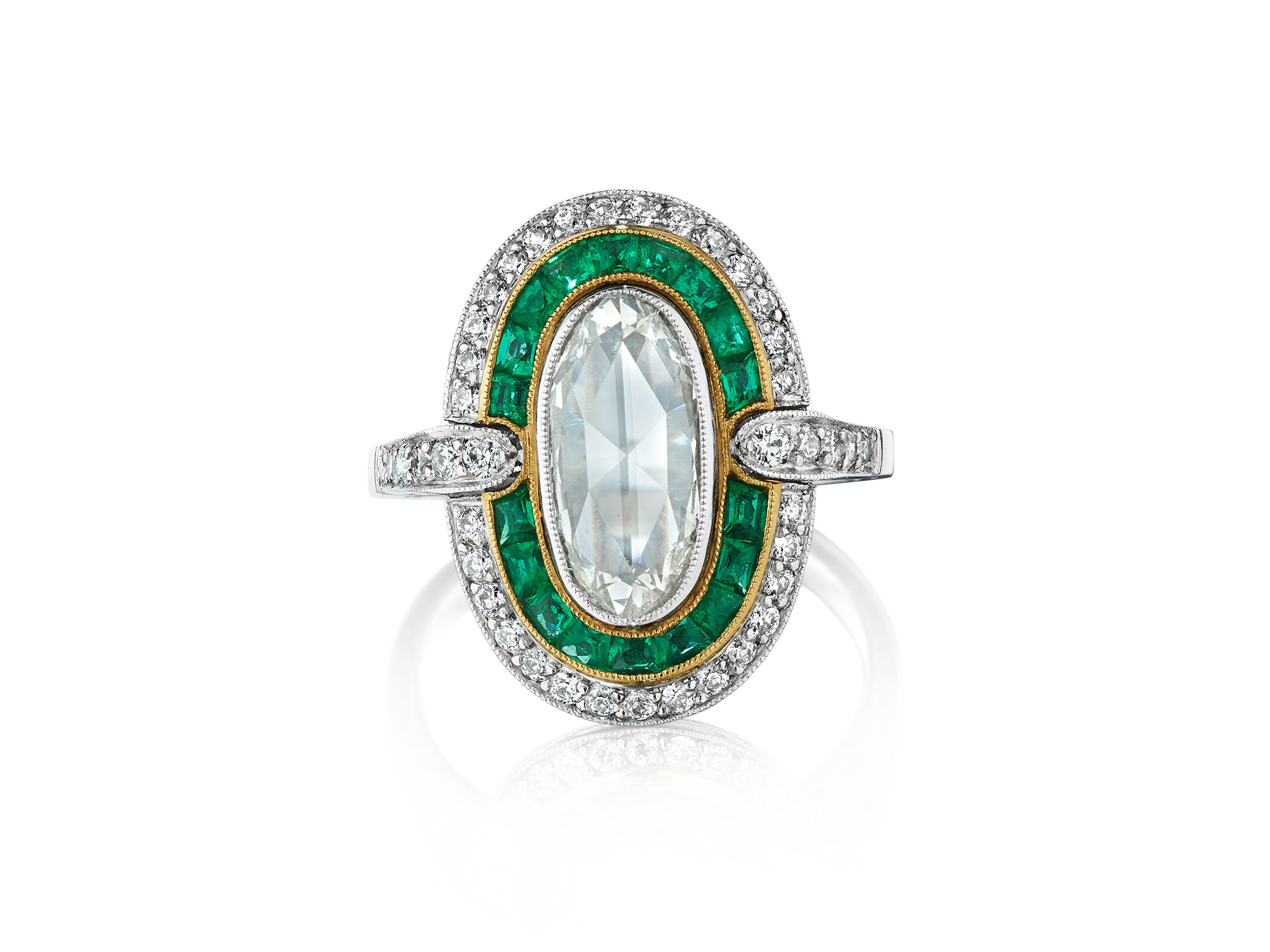 <p>A Diamond, Emerald, and Platinum Ring</p>