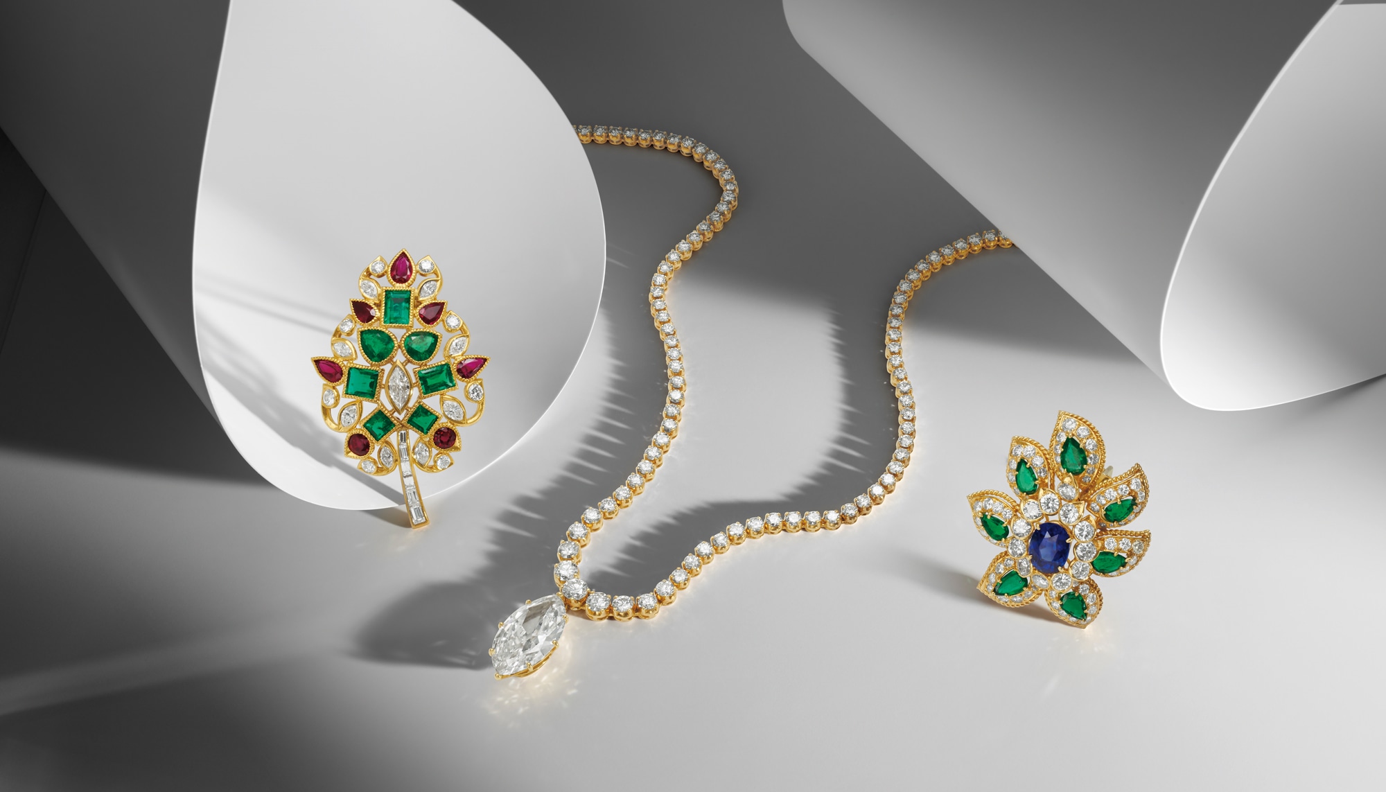 <p><strong>CARTIER</strong>. A Diamond, Emerald, and Ruby Clip Brooch, 1961; <strong>CARTIER</strong>. A Diamond Necklace; A Diamond Ring and Pendant Mount; <strong>VAN CLEEF &amp; ARPELS</strong>. A Sapphire, Emerald and Diamond Brooch,1966</p>
