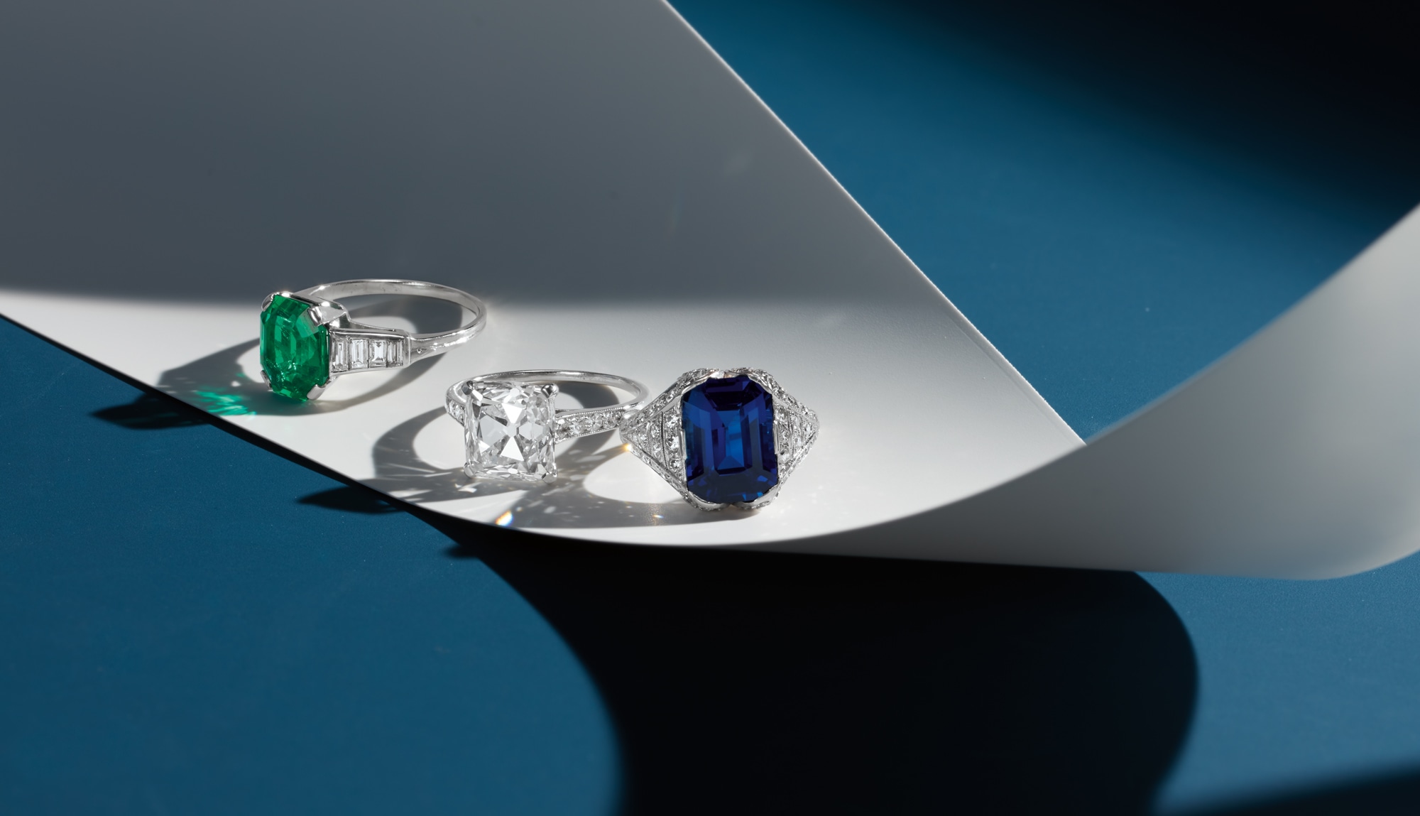 <p>An Art Deco Emerald and Diamond Ring; <strong>CARTIER</strong>. &nbsp;An Art Deco Diamond Ring; An Art Deco Sapphire and Diamond Ring</p>
