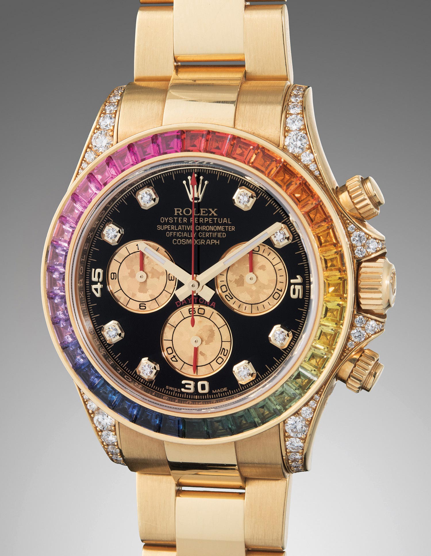 <b>ROLEX </b>Cosmograph Daytona Rainbow, Reference 11659RBOW. A yellow gold, diamond and rainbow-colored multi-gem set chronograph wristwatch with bracelet, circa 2012