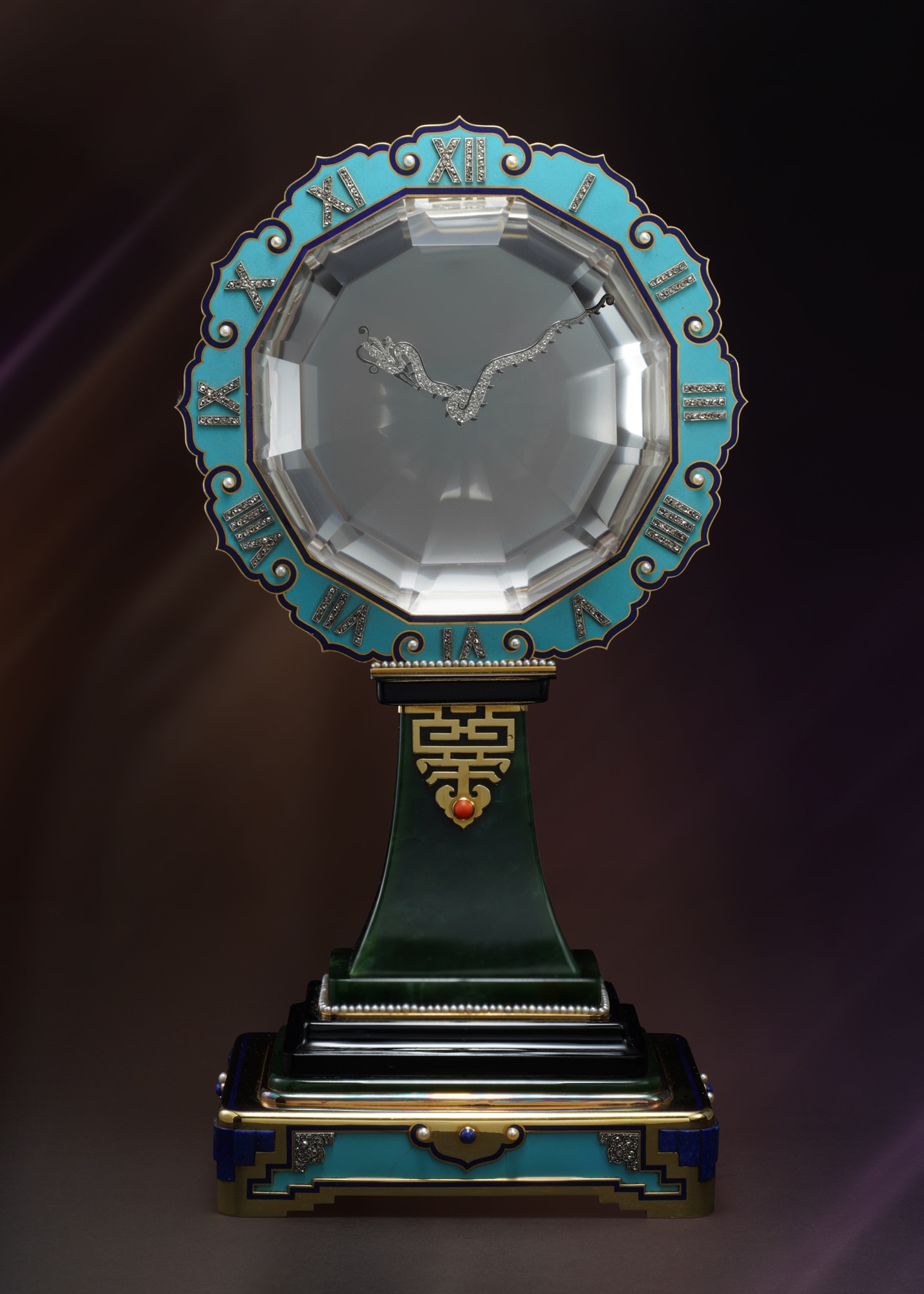 <p><strong>CARTIER</strong> <em>A museum quality, yellow gold, rock crystal, jade, diamond, onyx, coral, pearl, and enamel single axle mystery clock, </em>circa 1926</p>