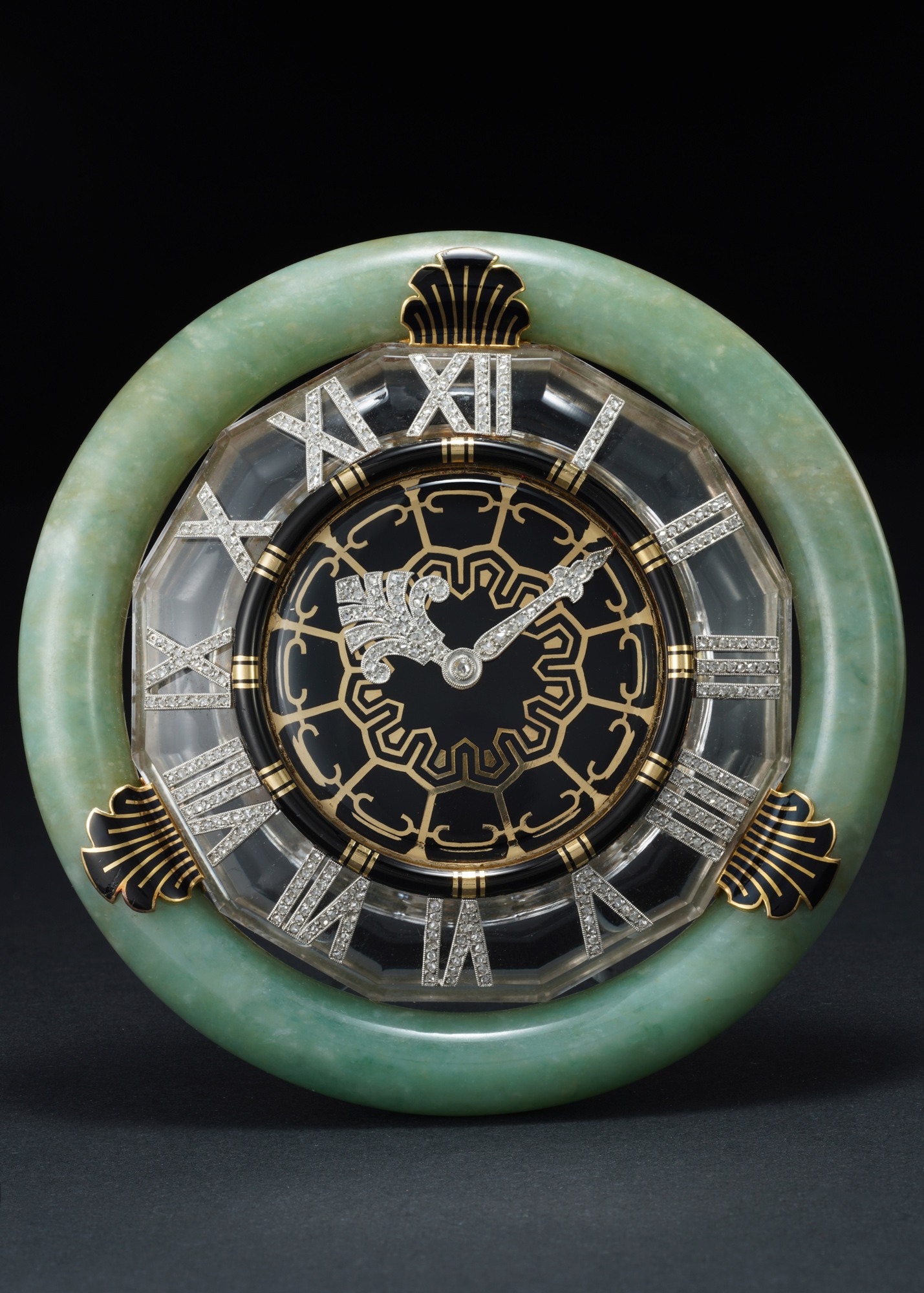 <p><strong>CARTIER</strong><em> A jade, rock crystal, and enamel desk clock with diamond-set numerals and hands,</em> circa 1930</p>