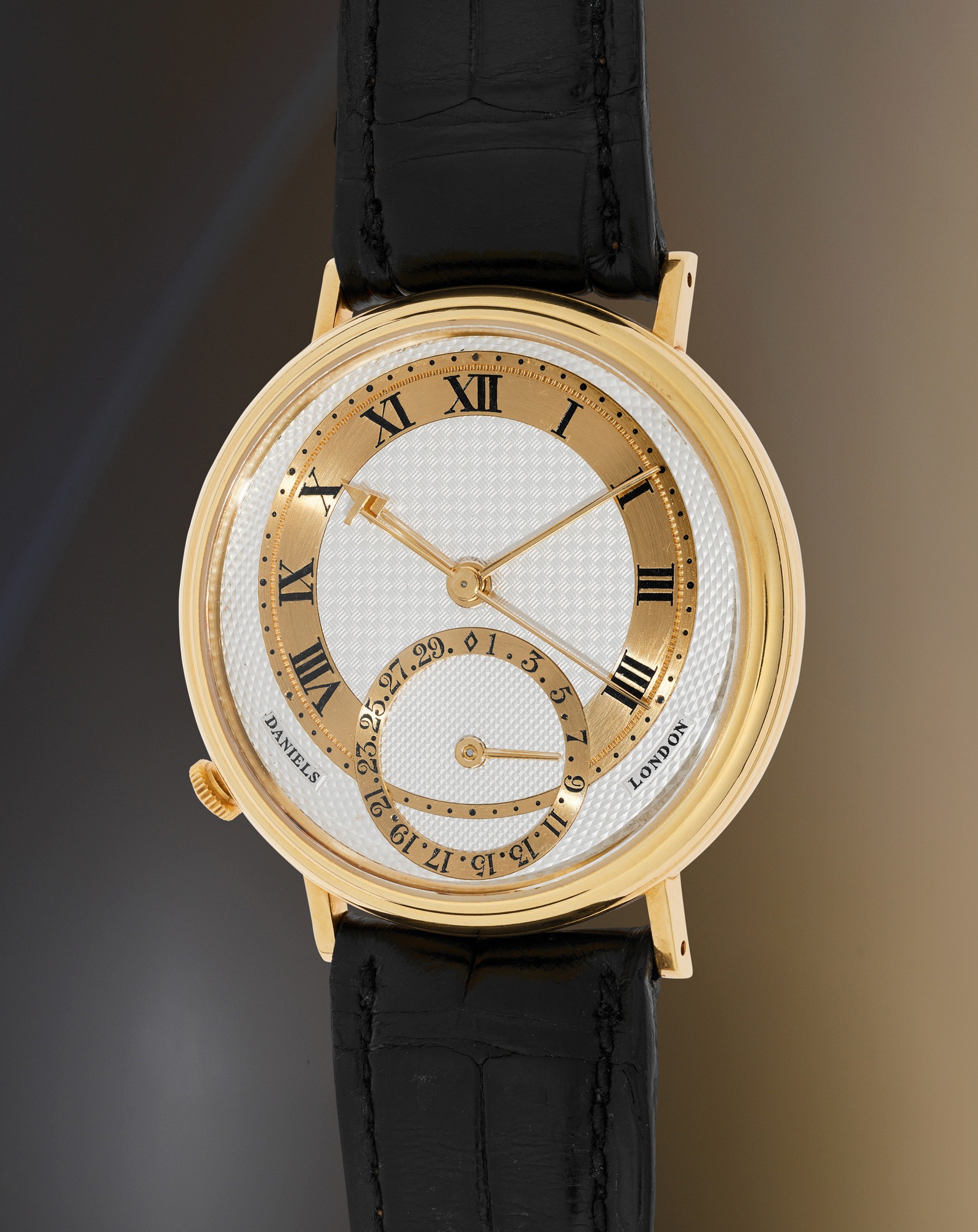 <p><strong>GEORGE DANIELS&nbsp;</strong><em>&ldquo;Millennium.&rdquo; A superb and extremely rare yellow gold wristwatch with co-axial escapement, date, and presentation box, part of a limited series of 48 pieces,</em>&nbsp;circa 1999</p>
